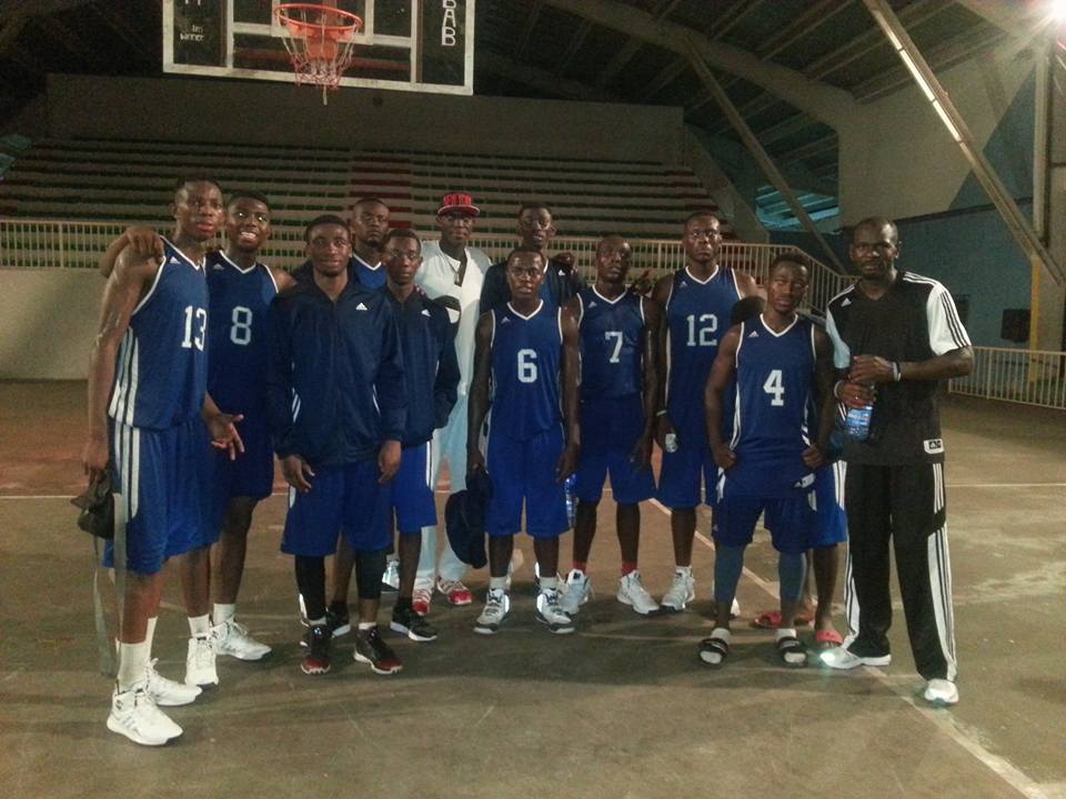 PJB players with the rest of their national team teammates after their qualifying victory. Patrick Mwamba (No. 13), Lucien Mwamba (No. 8), Jospin Basima (No. 5, wearing jacket), Philipe Kasereka (No. 6), Michee Mianga (No. 12), Jerry Kabantu (No. 4) and Coach Kipere Mulolwa (far right).