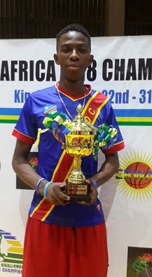 Photo of Patrick Mwamba with his trophy as the best shooter in the tournament.