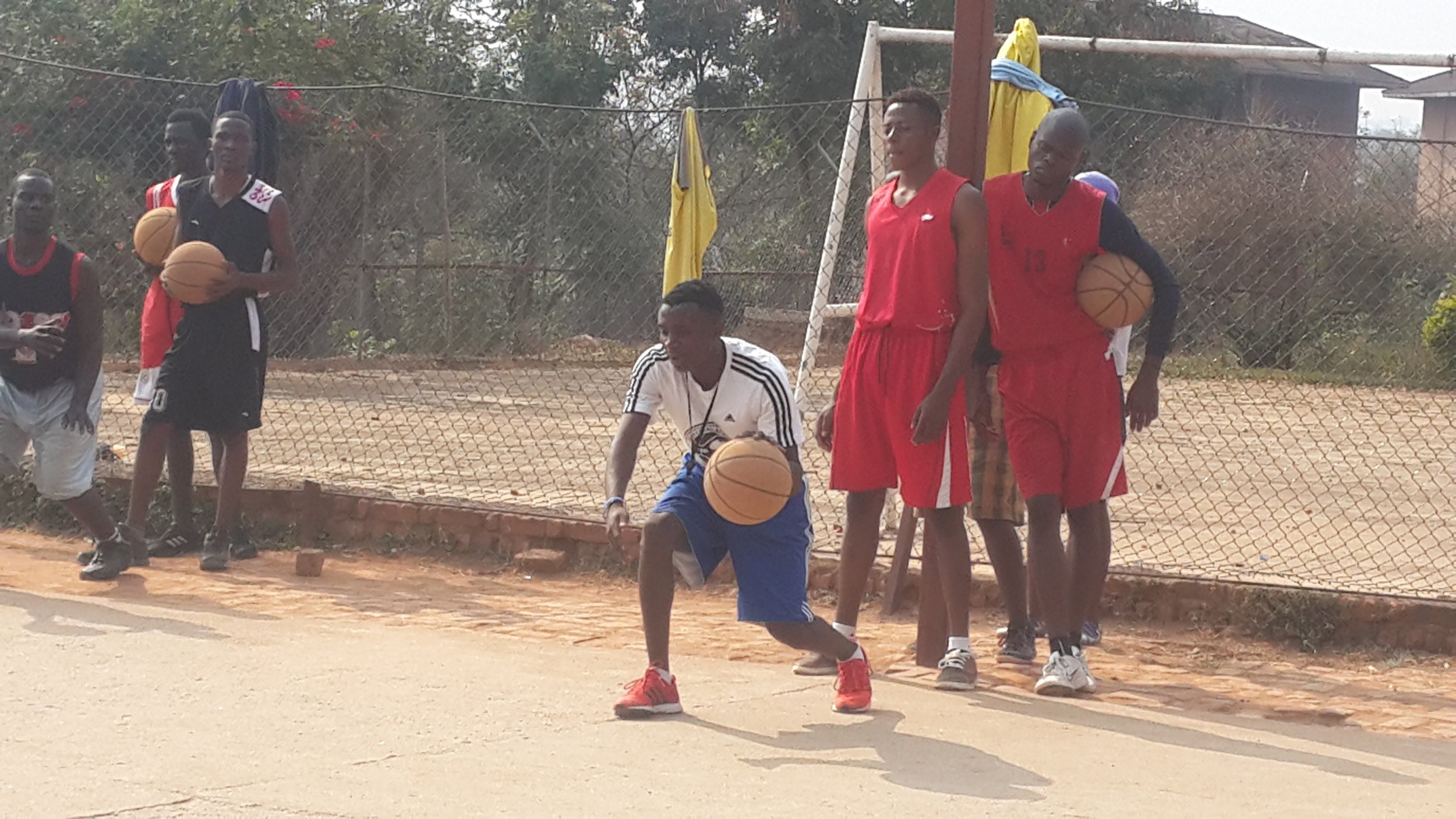 Coach Denny teaching the beginners dribbling techniques