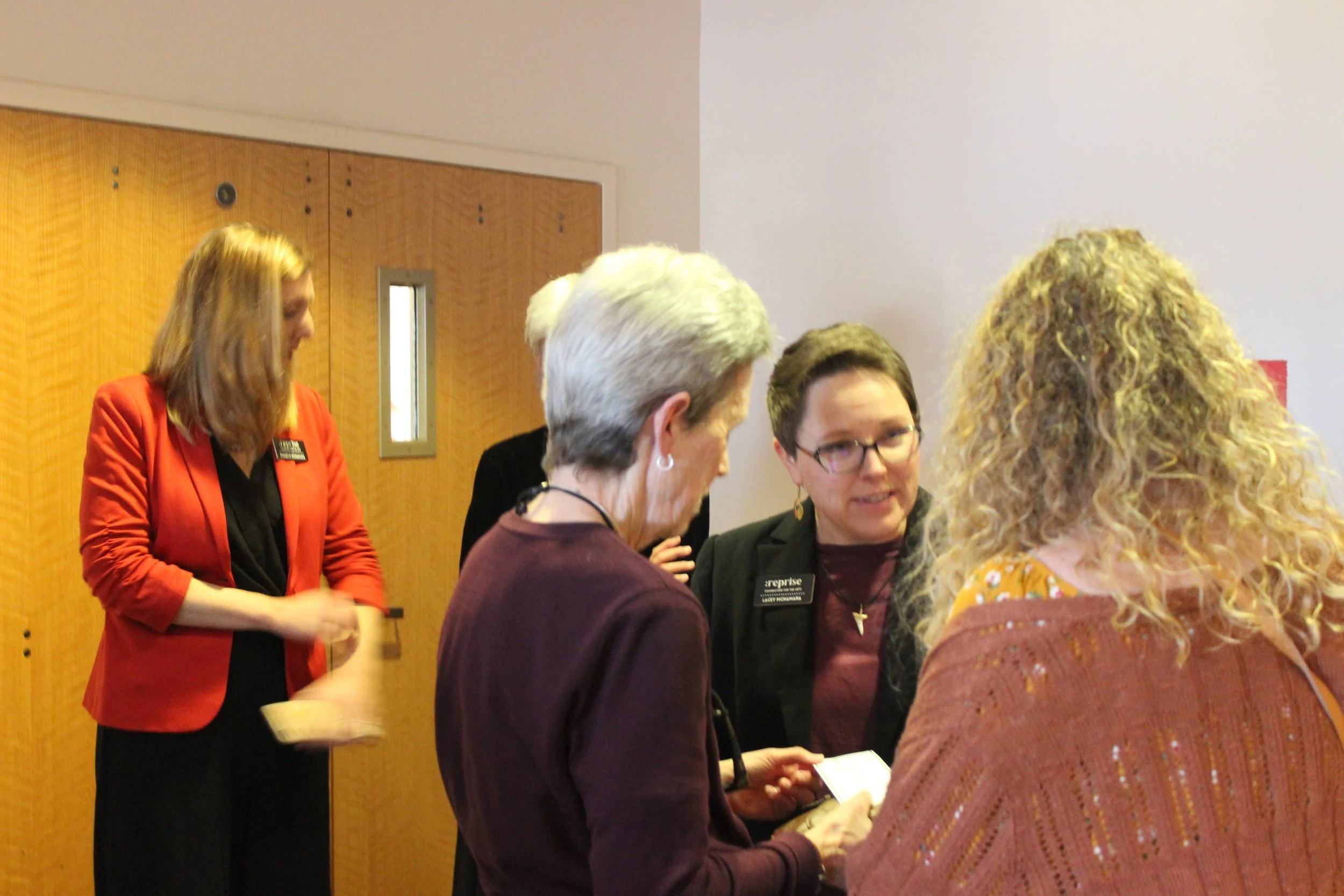  Co-founder/Treasurer Danielle McNamara and Co-founder/President Lacey McNamara chat with concert sponsors 