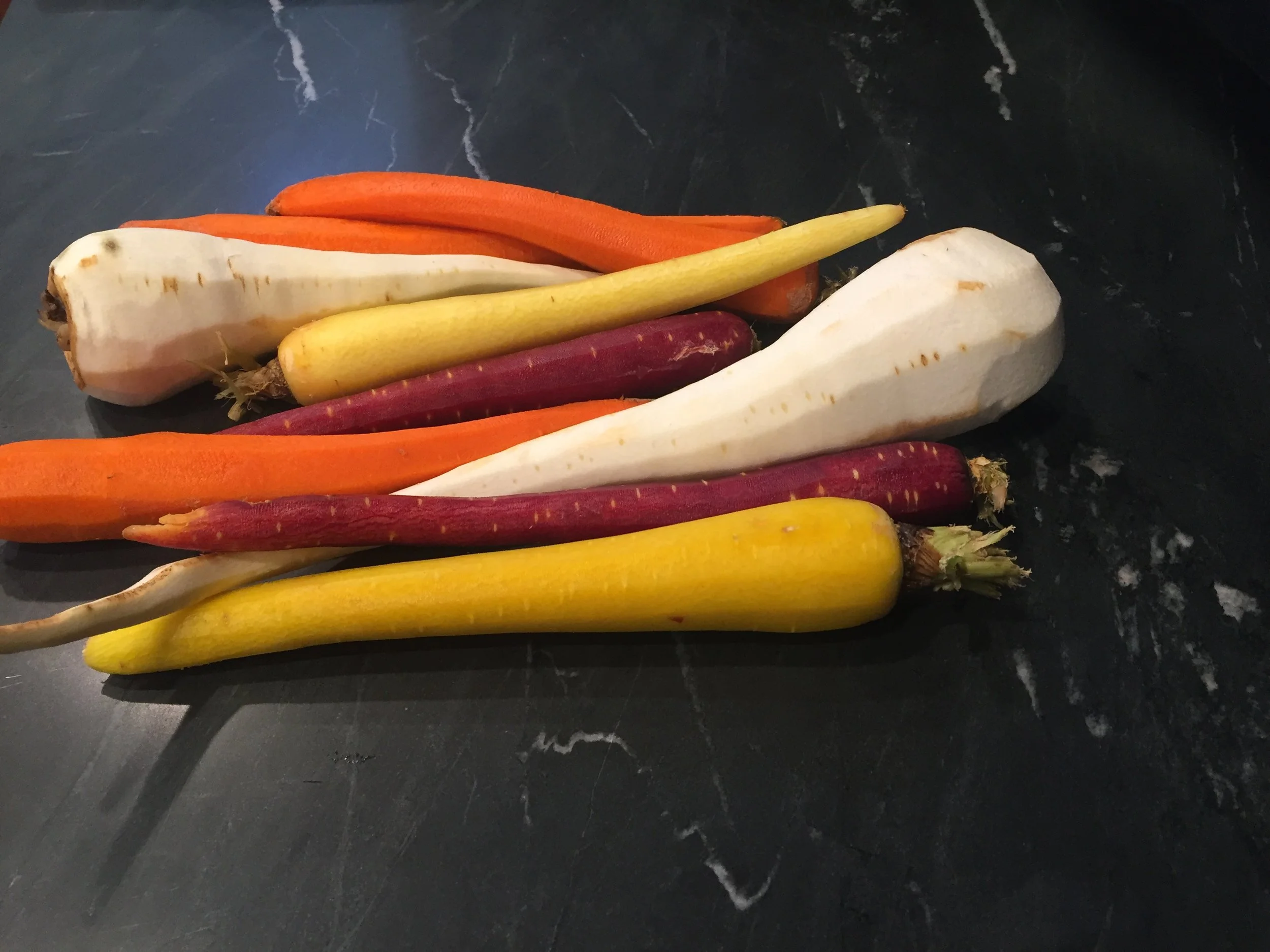 Look at these stunning heirloom carrots and parsnip that I got at the farmers market this weekend. 
