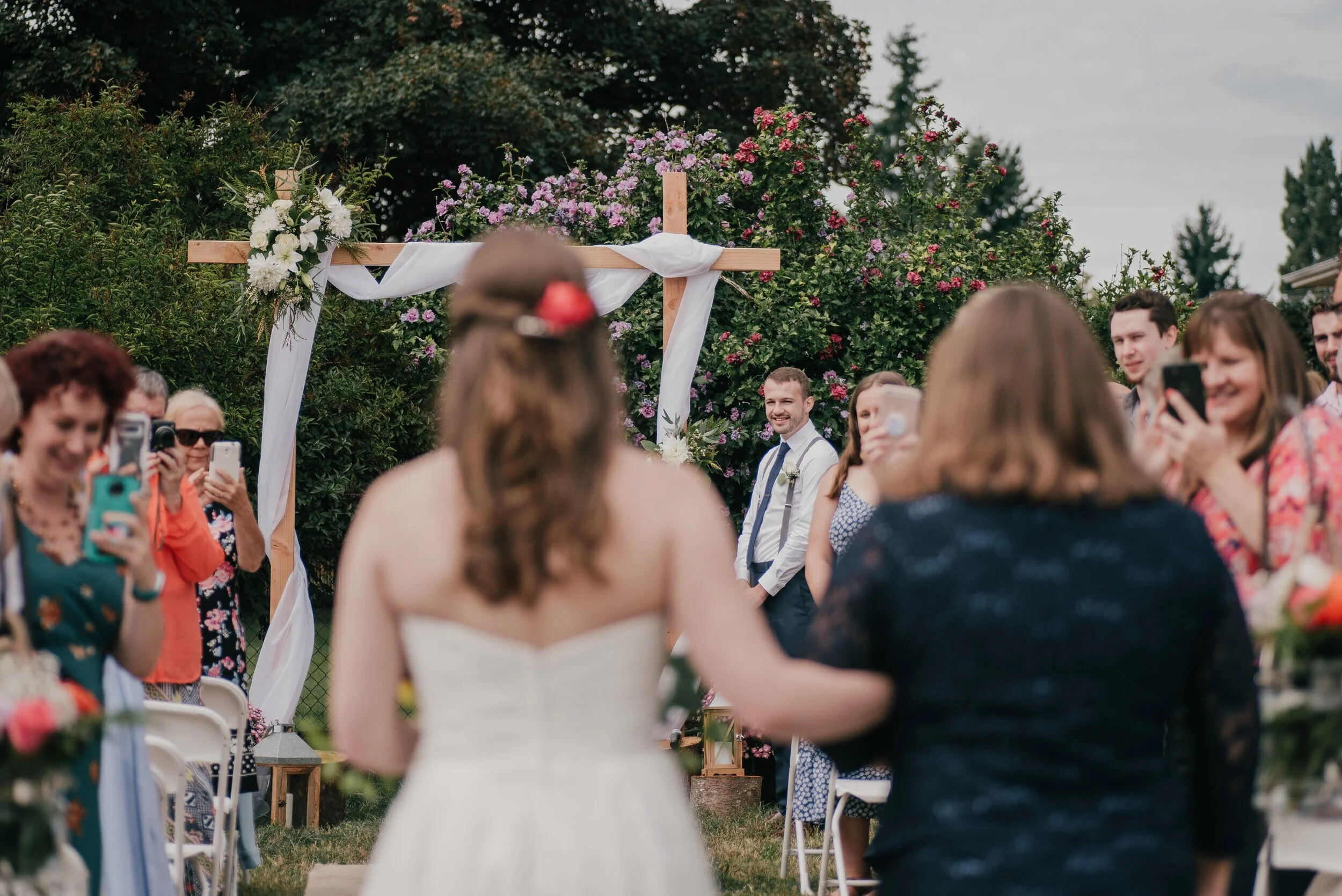 the couple chose not to do a first look and this was the first tike the groom saw the bride. there were no less than 6 cell phones, all on the aisle so i couldn’t even angle myself to avoid them!