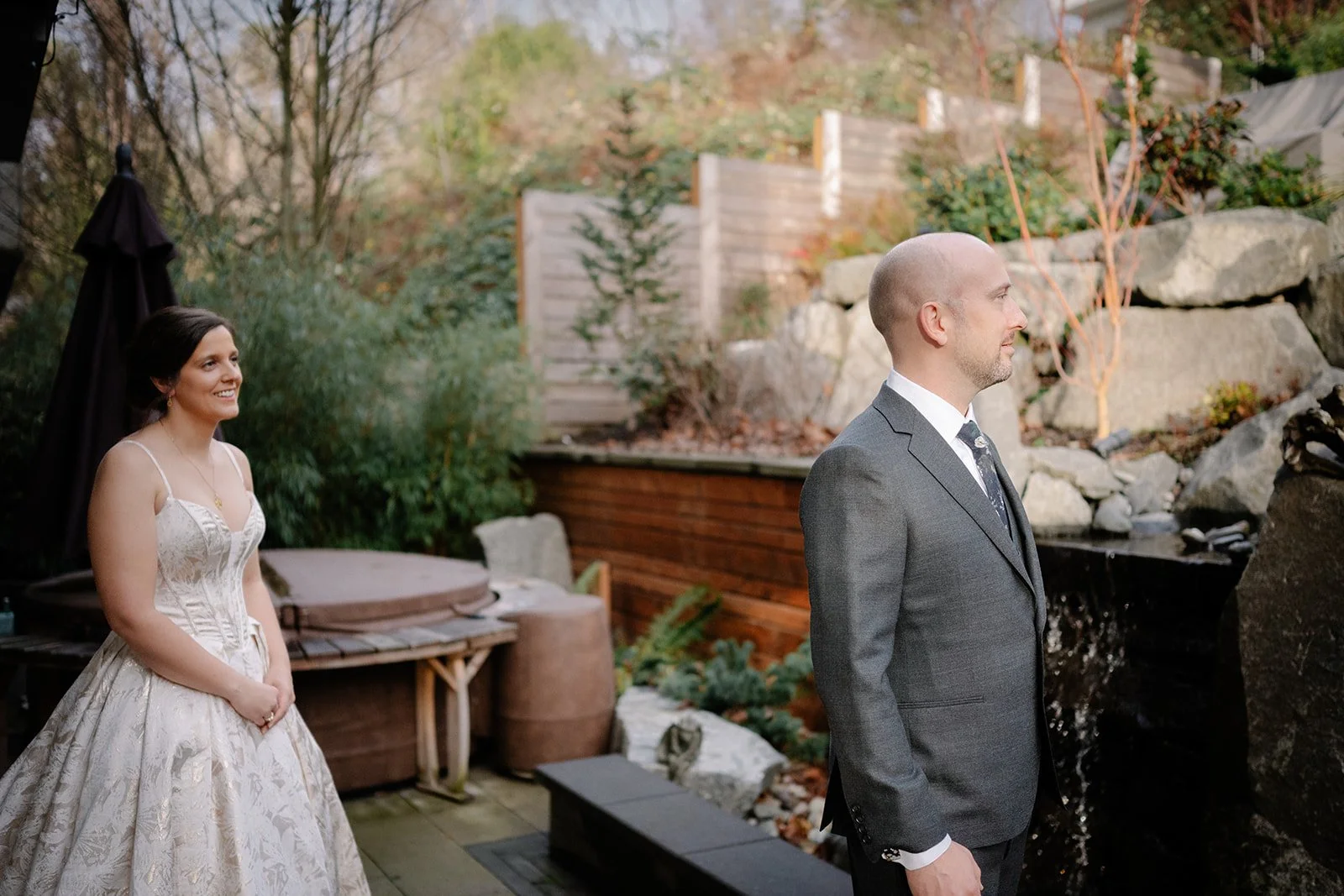 candid bride and groom first look at home