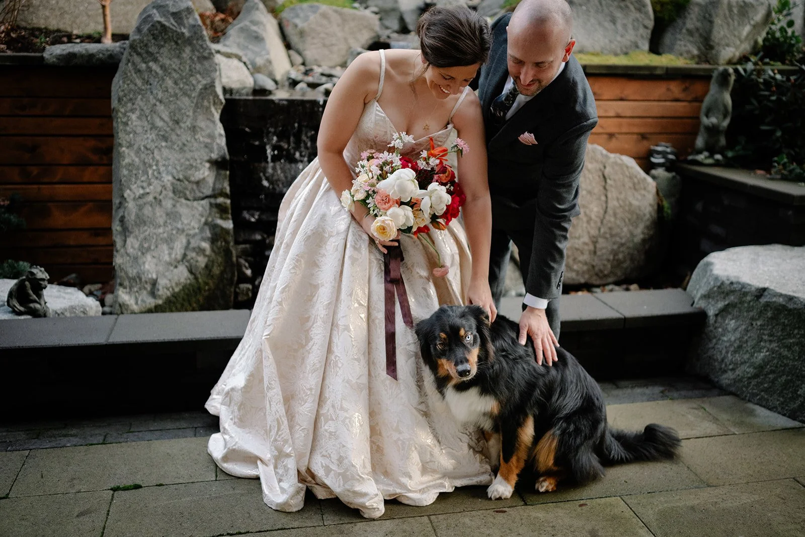 bride and groom with their dog