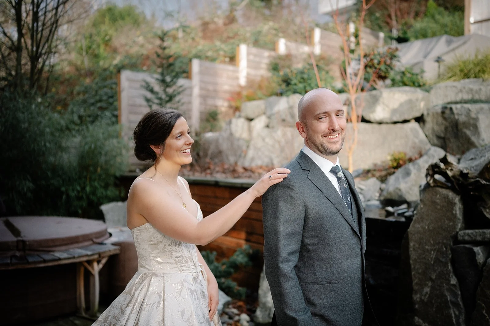 candid bride and groom first look at home