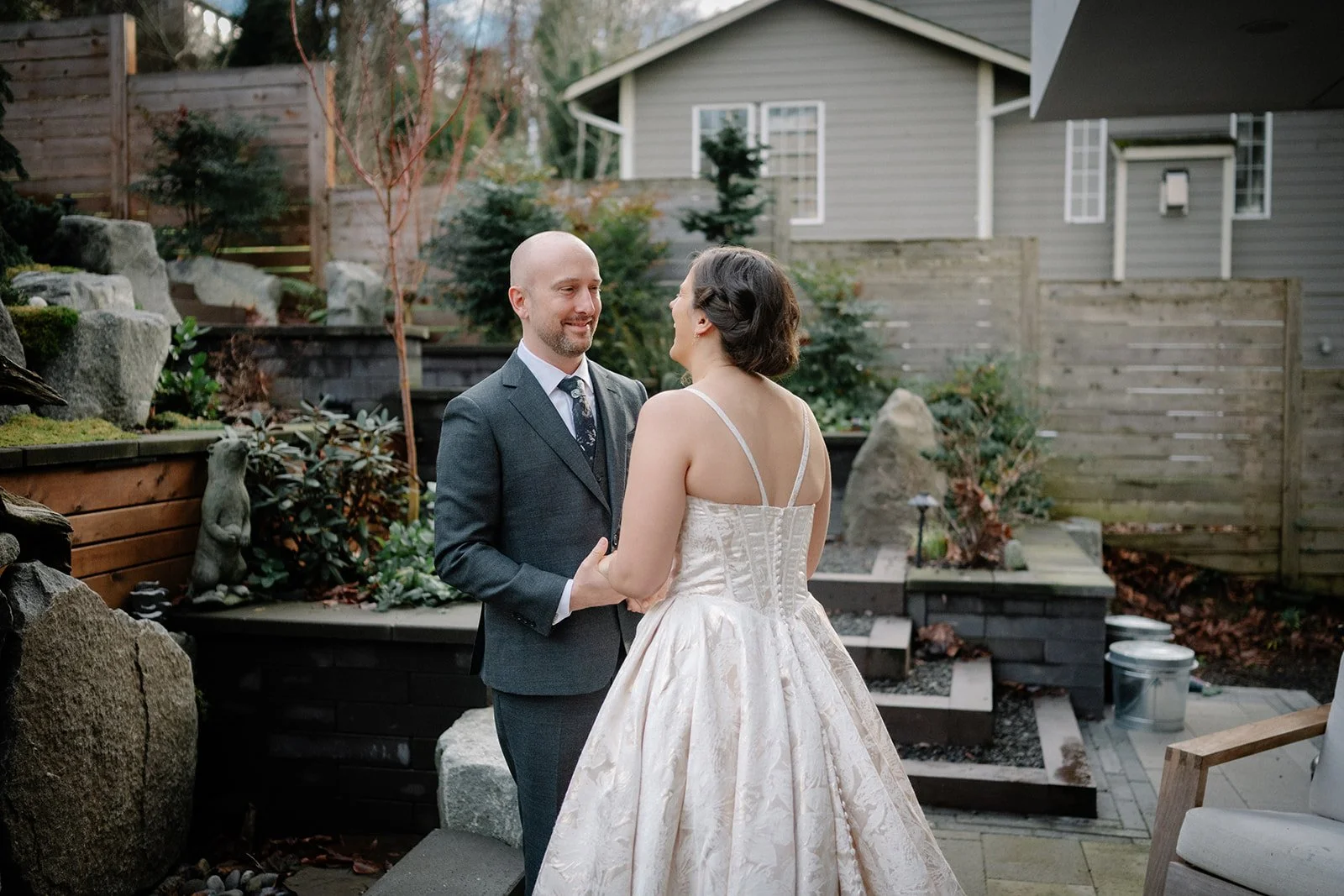 candid bride and groom first look at home