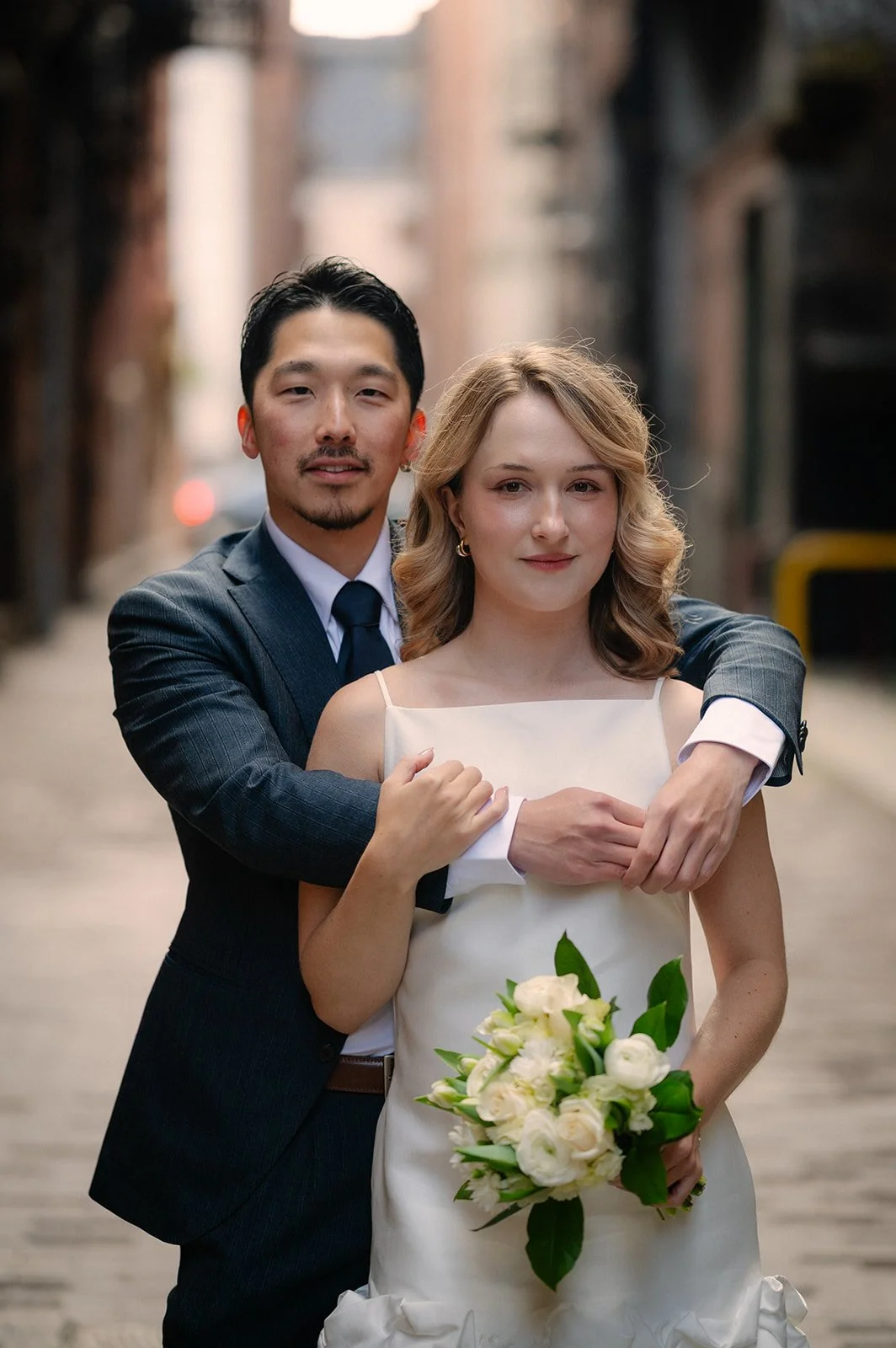 playful bride and groom at the pioneer square during their elopement day in seattle