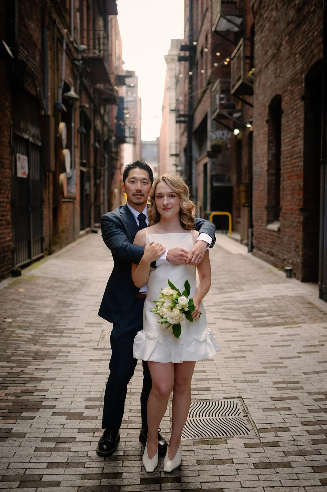 bride and groom at pioneer square during their seattle courthouse elopement day