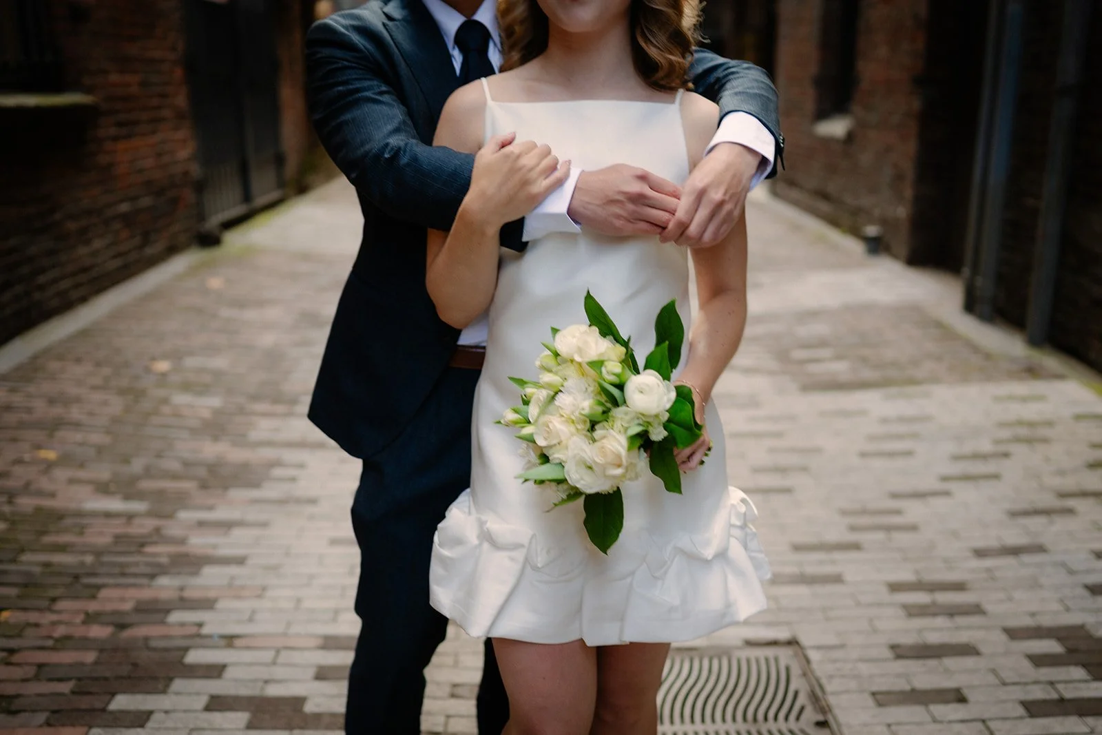 playful bride and groom at the pioneer square during their elopement day in seattle