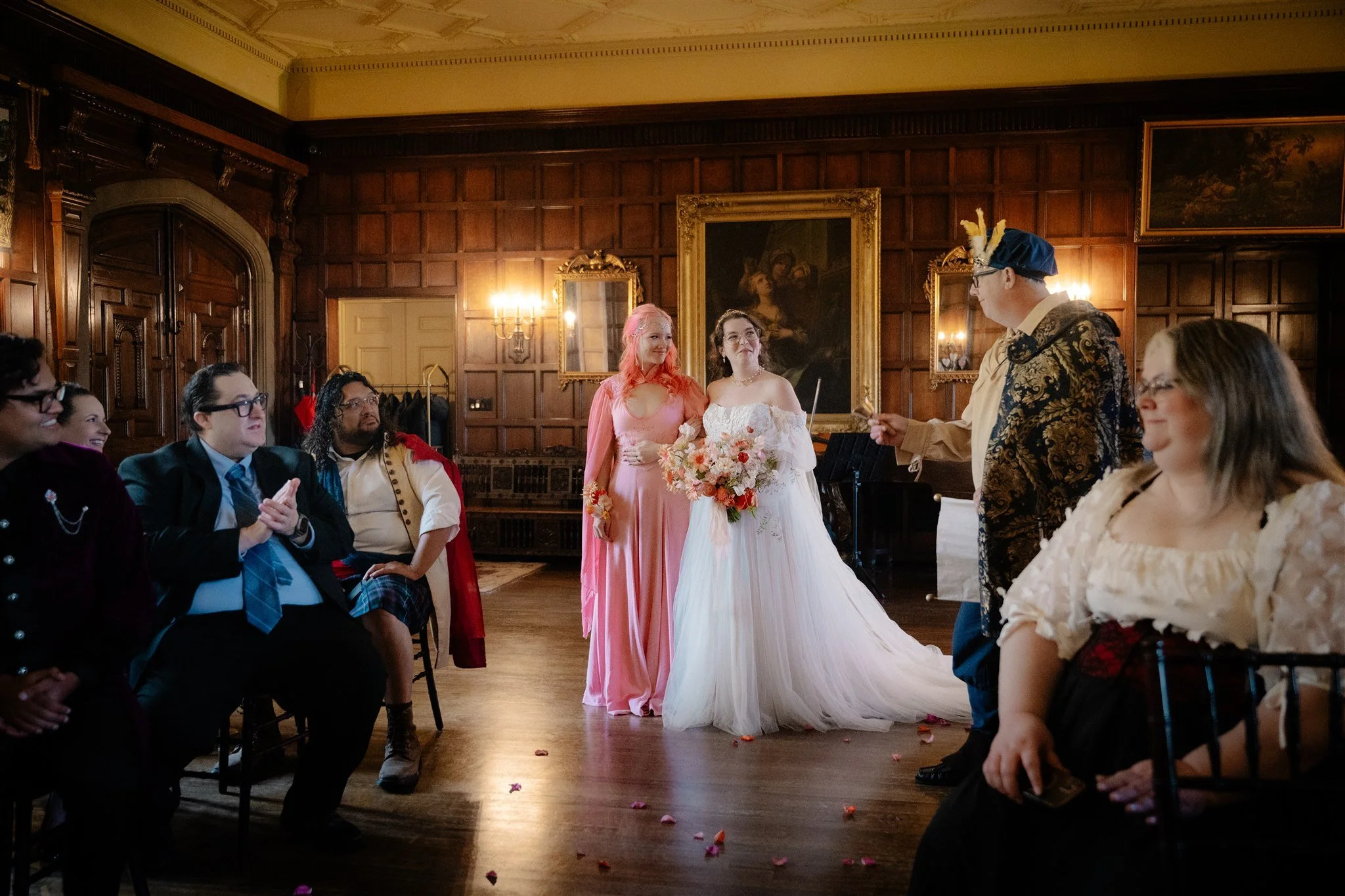 bride walking down the aisle with her maid of honor in a fairy outfit