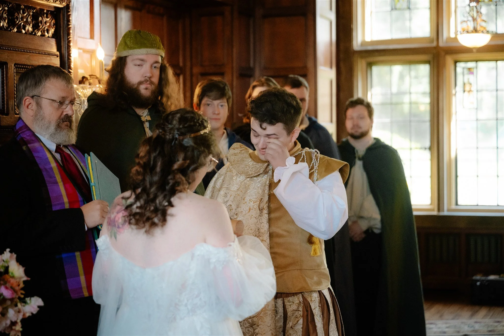 candid moments from an indoor wedding ceremony at thornewood castle