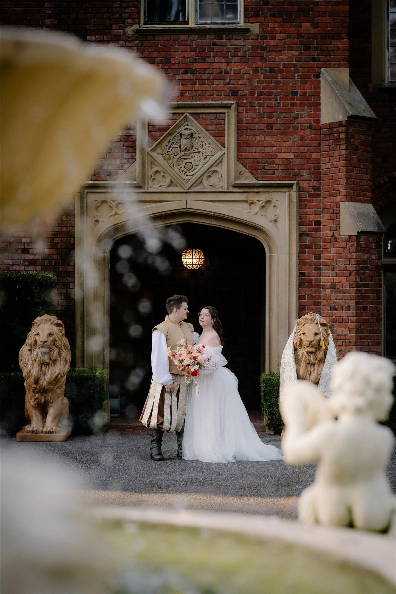 bride and groom holding hands in front of thornewood castle