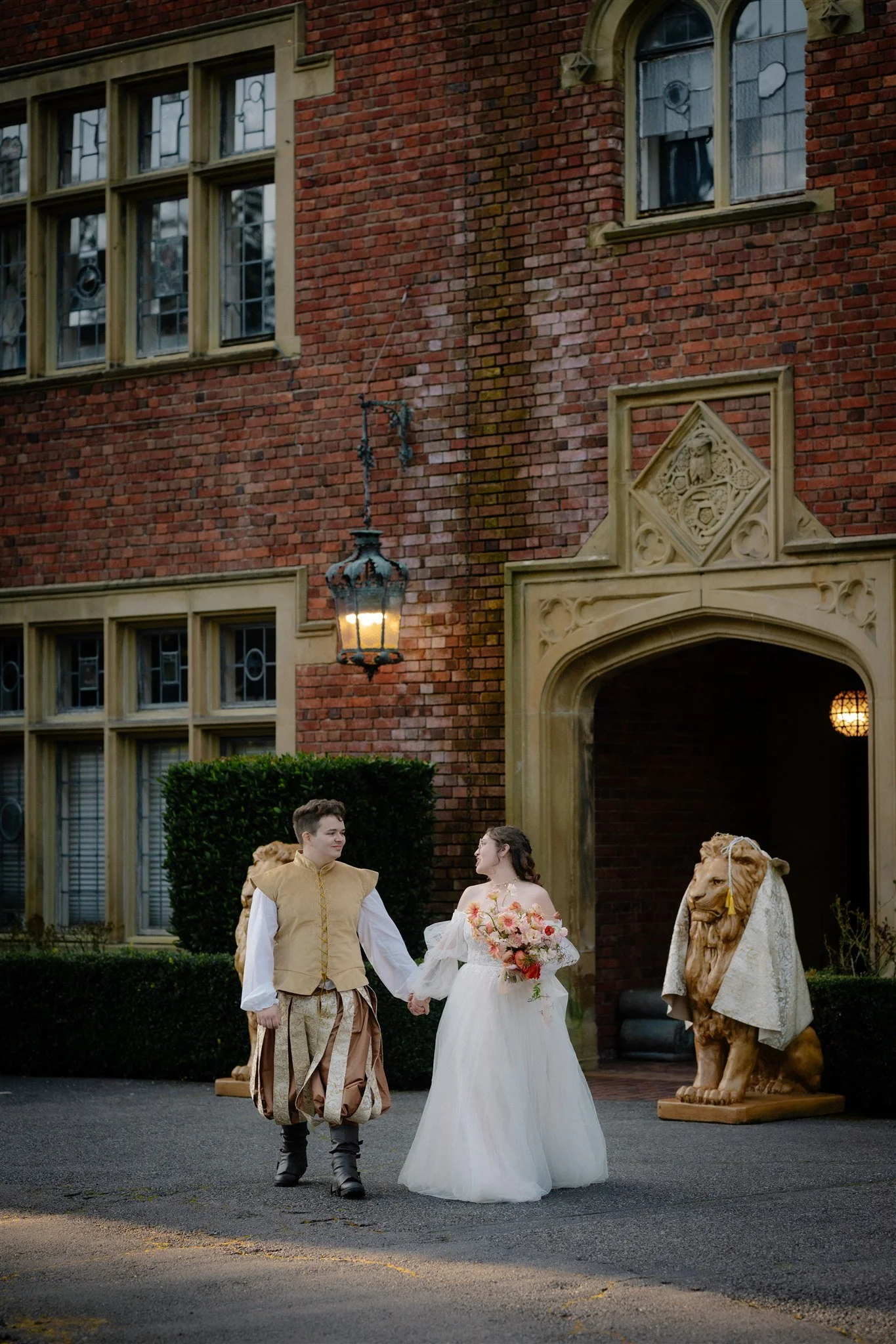 bride and groom holding hands in front of thornewood castle