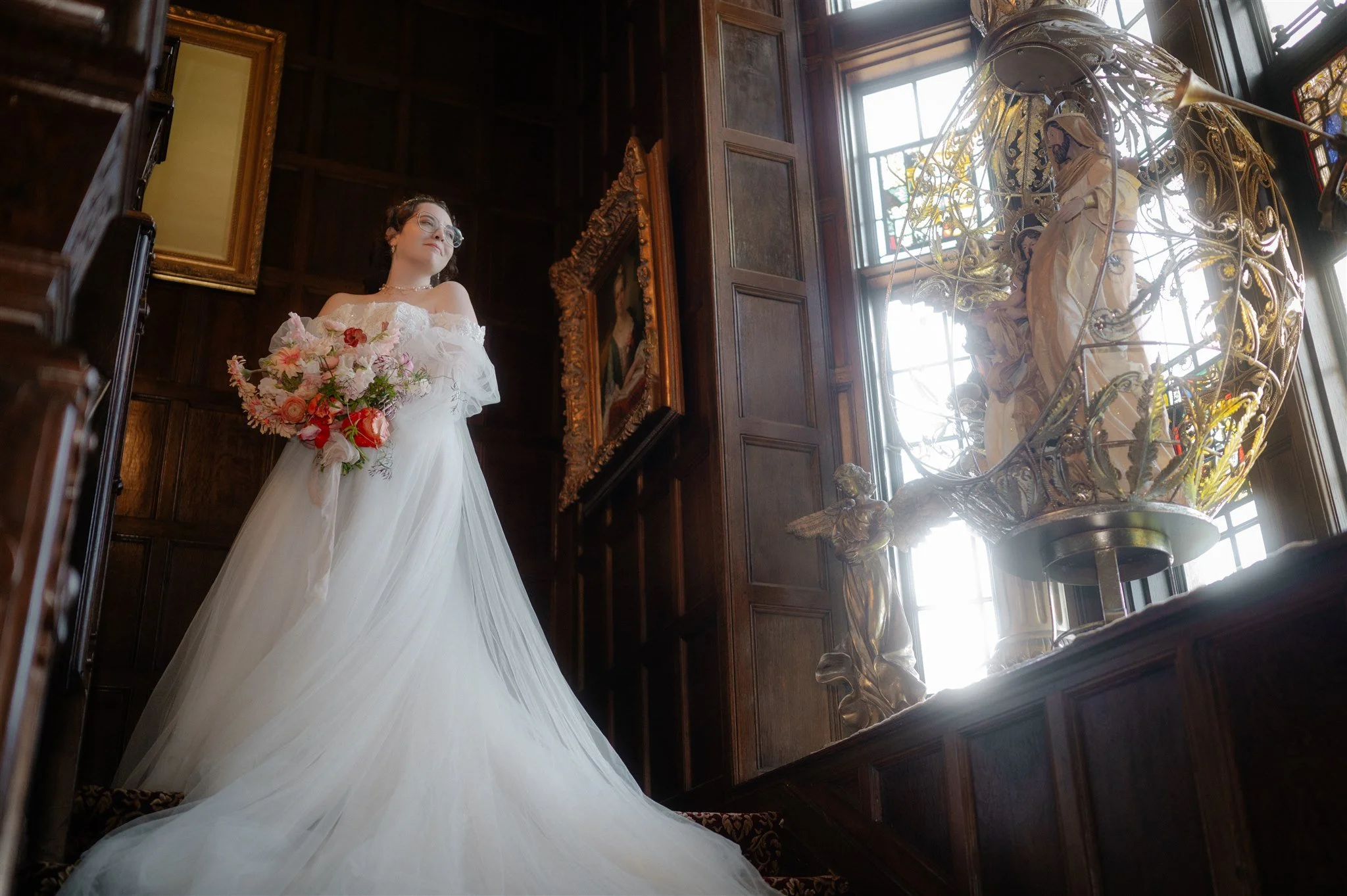 bride on the steps during their thornewood castle wedding