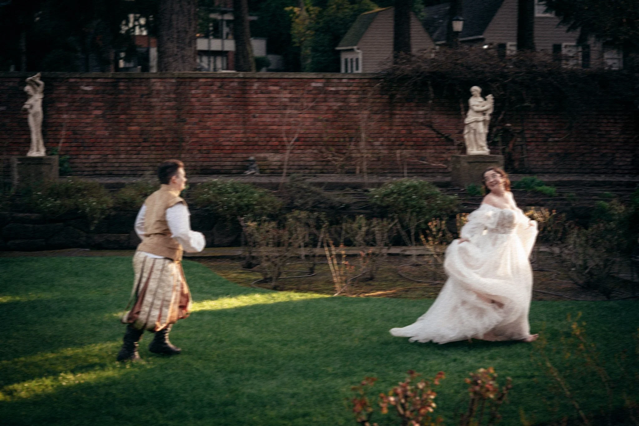 bride and groom running around the grounds of thornewood castle