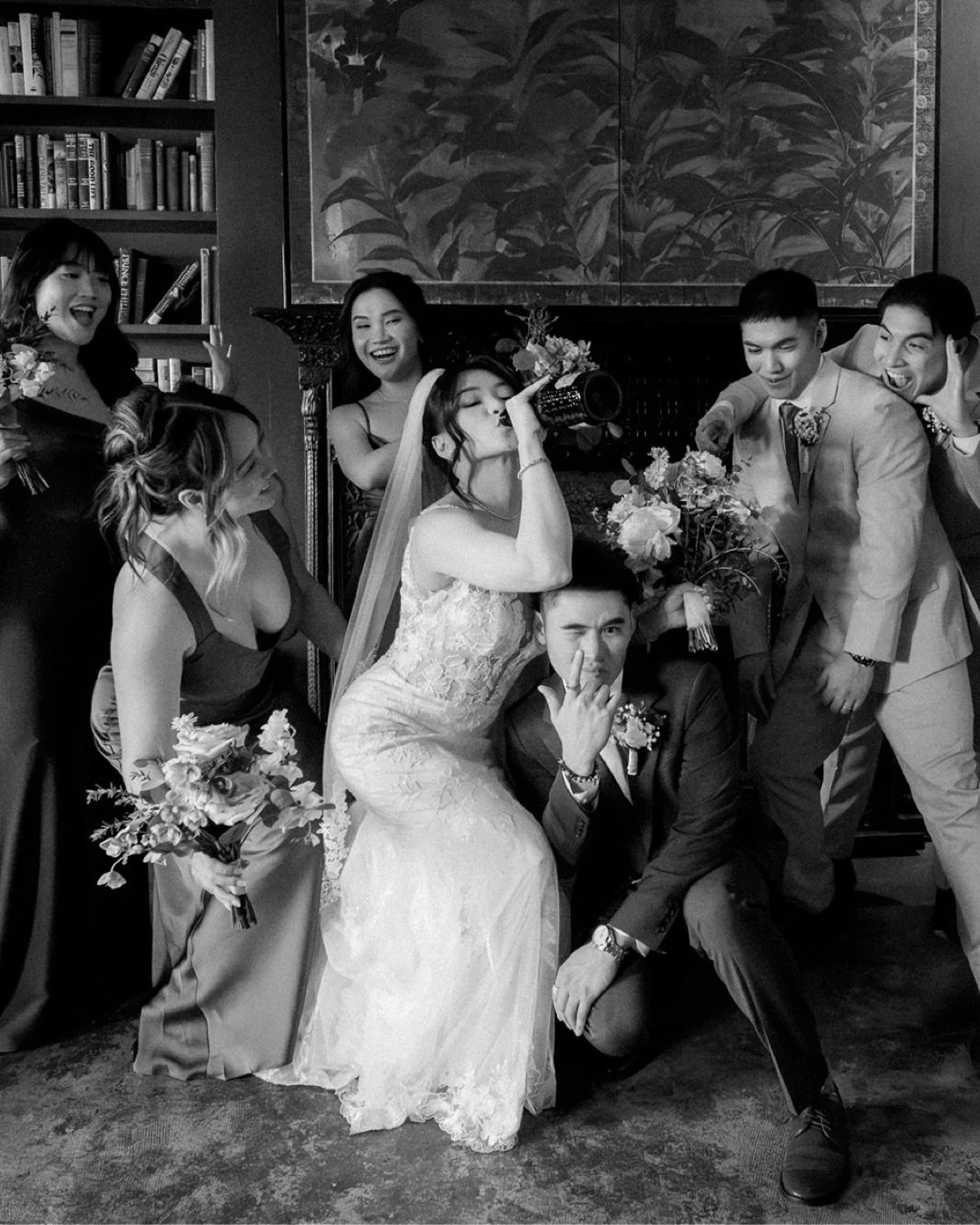 she&rsquo;s drinking straight from the bottle and honestly? this is exactly my kind of couple.

a bride mid-swig, a groom squat-posing like he&rsquo;s in a music video, a wedding party losing it in the best way. this is what it looks like when people