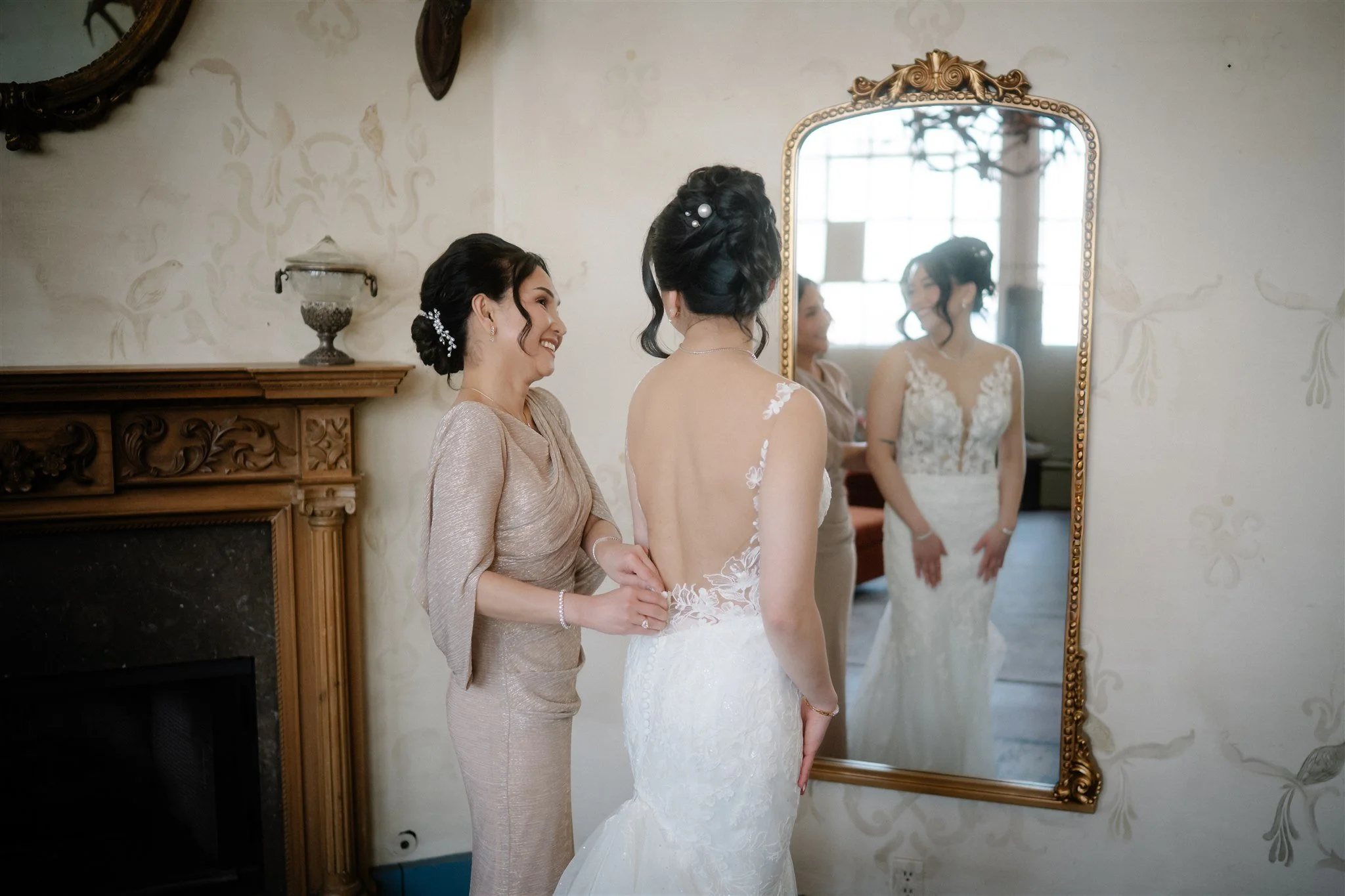 bride getting ready with her mom