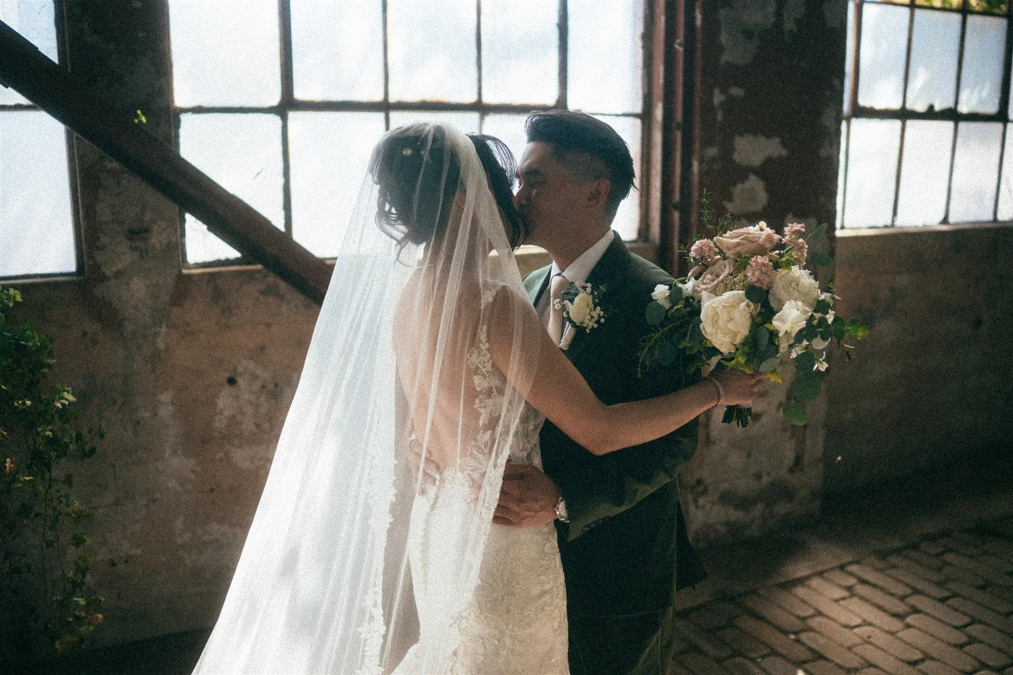 First look wedding photo at The Ruins Seattle with soft natural light