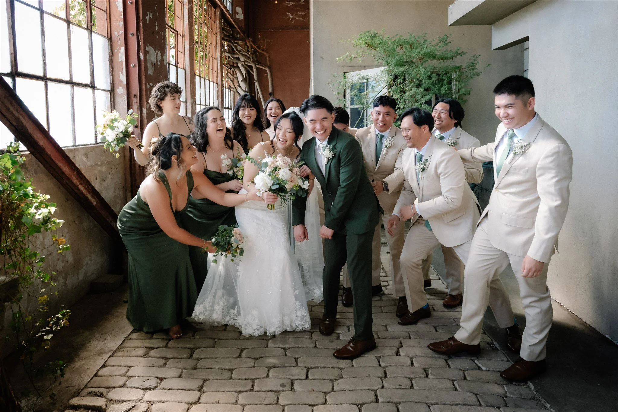 Wedding party photography with neutral suits and green wedding color palette