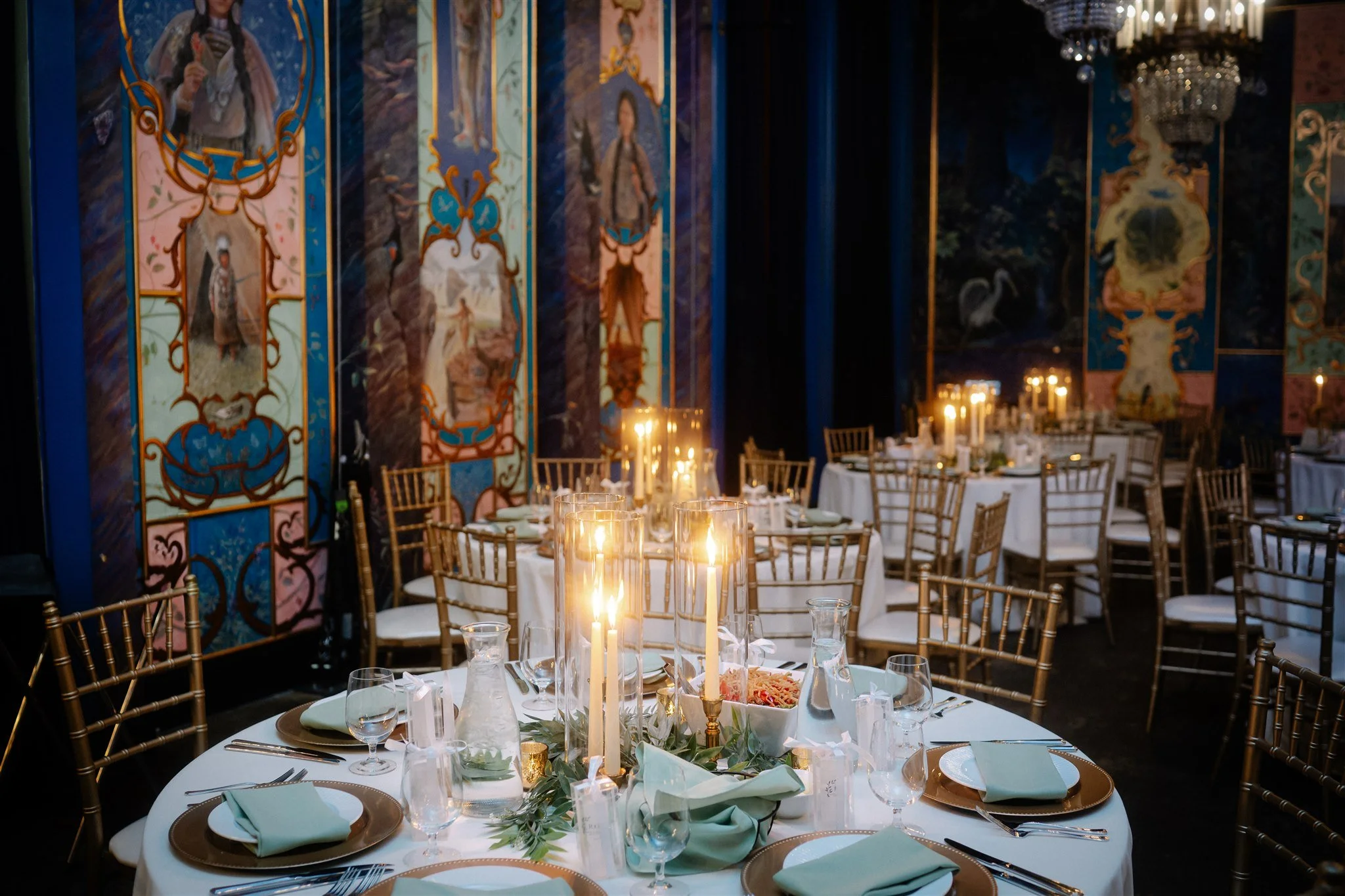 Luxury Seattle wedding reception with tall candles and gold chairs