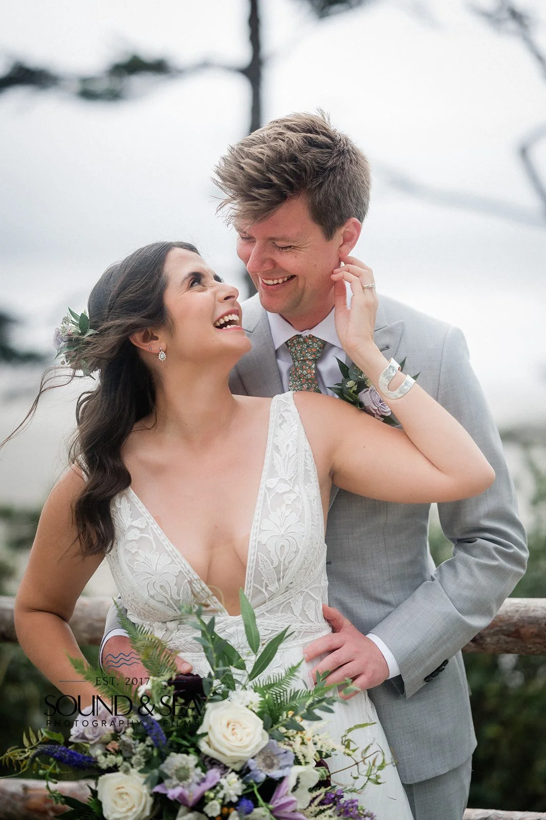 playful bride and groom on the coast during their seabrook wa wedding day