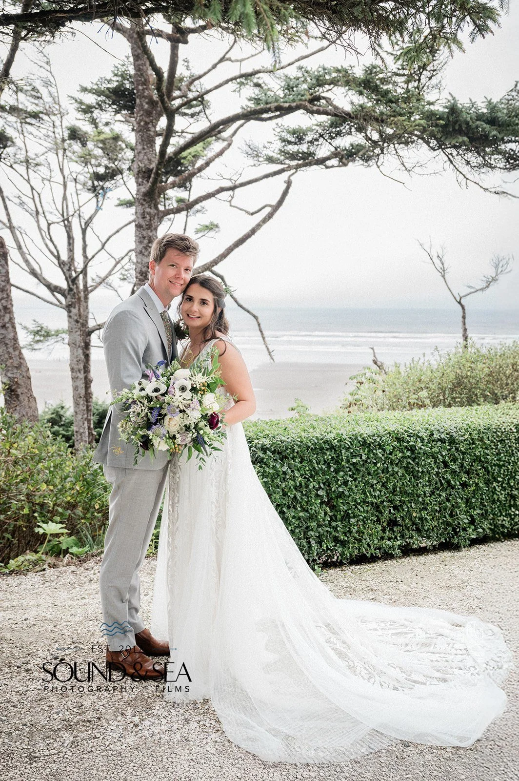playful bride and groom on the coast during their seabrook wa wedding day
