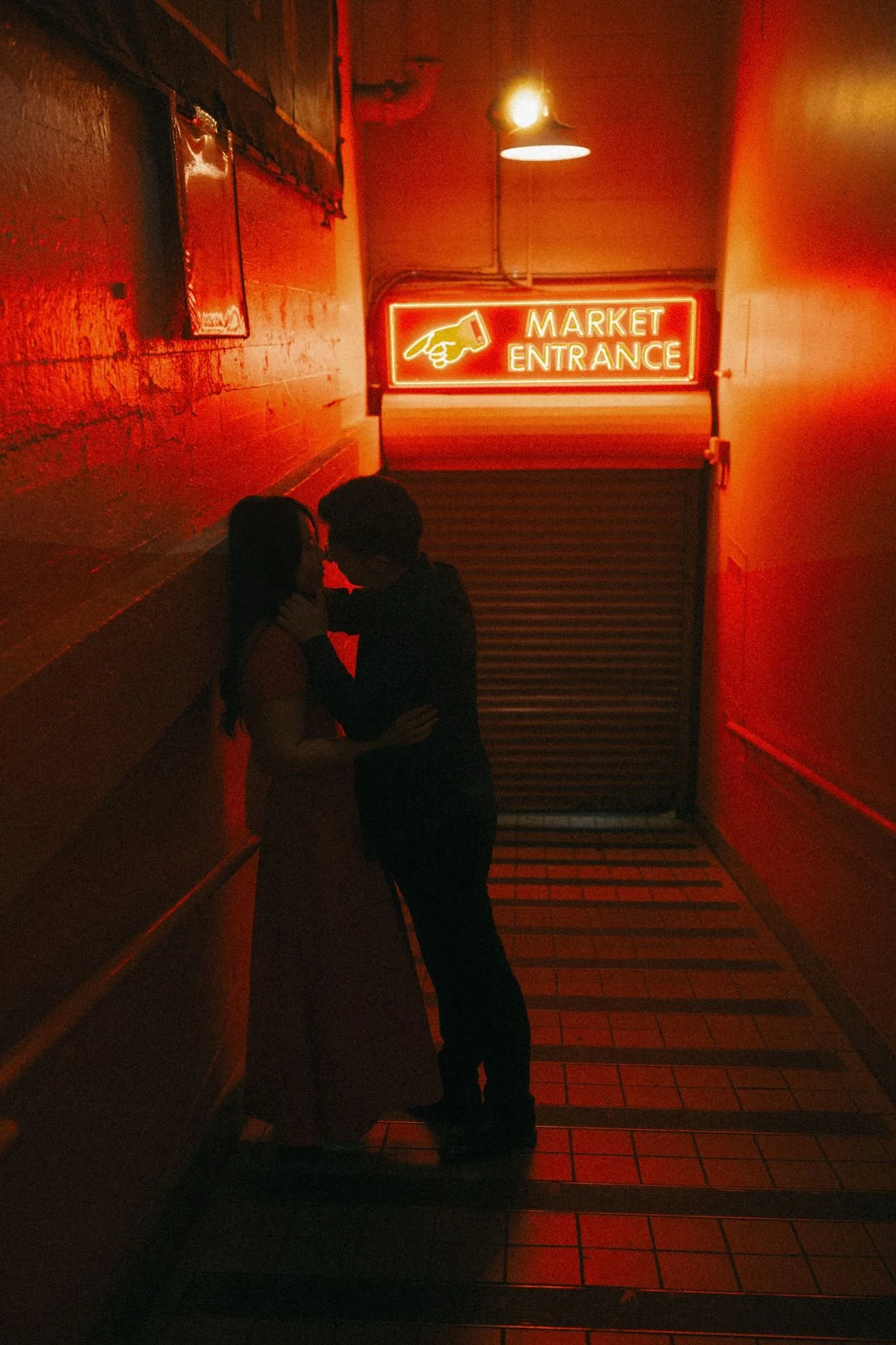 asian couple during their seattle engagement at pike place market