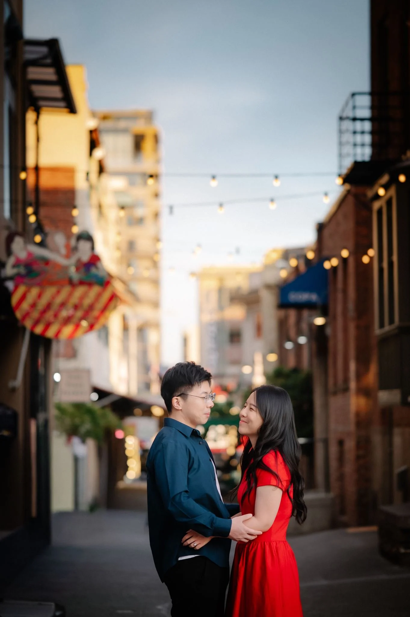 asian couple during their seattle engagement at pike place market