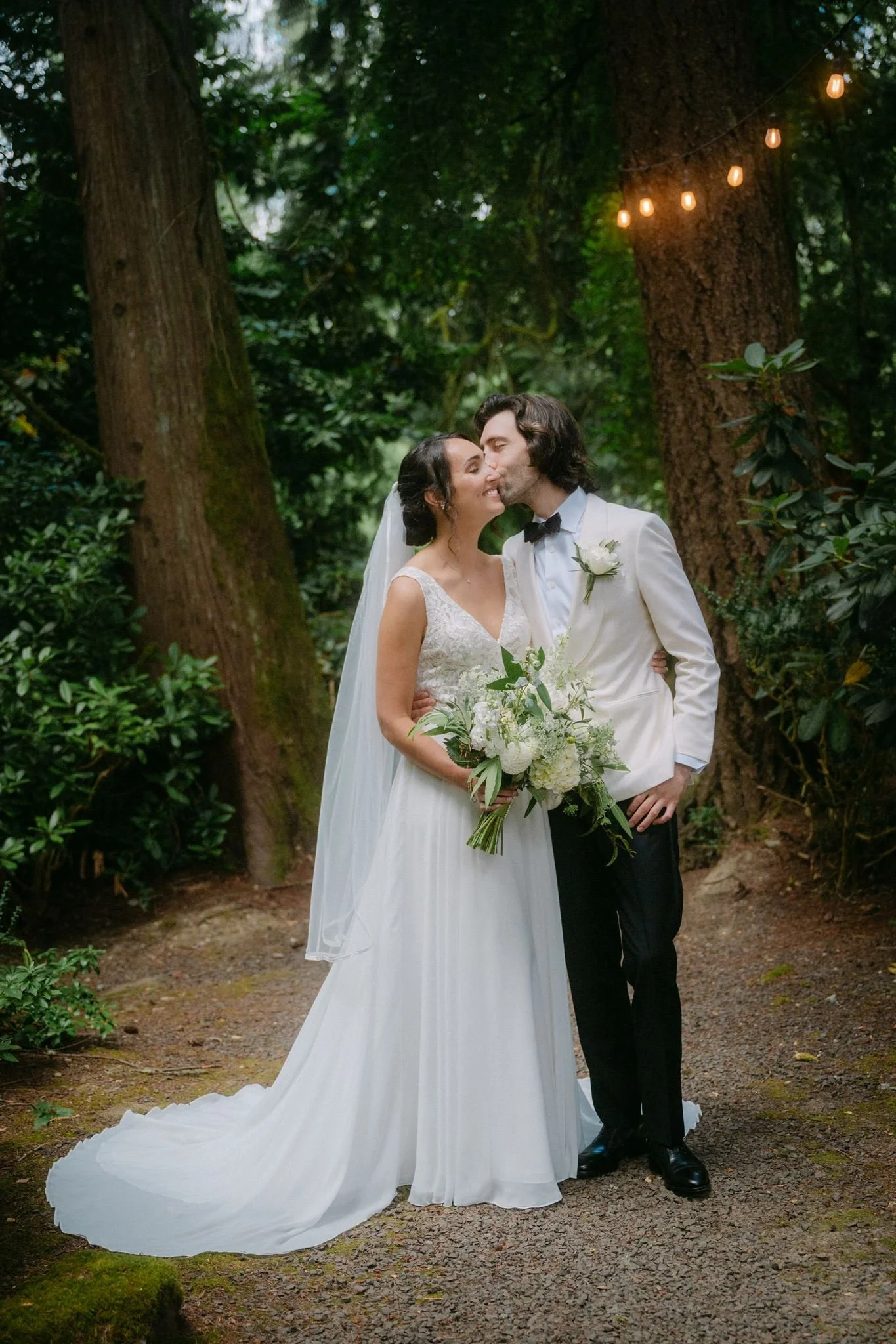 bride and groom surrounded by lush green landscapes of carnation farms wedding day