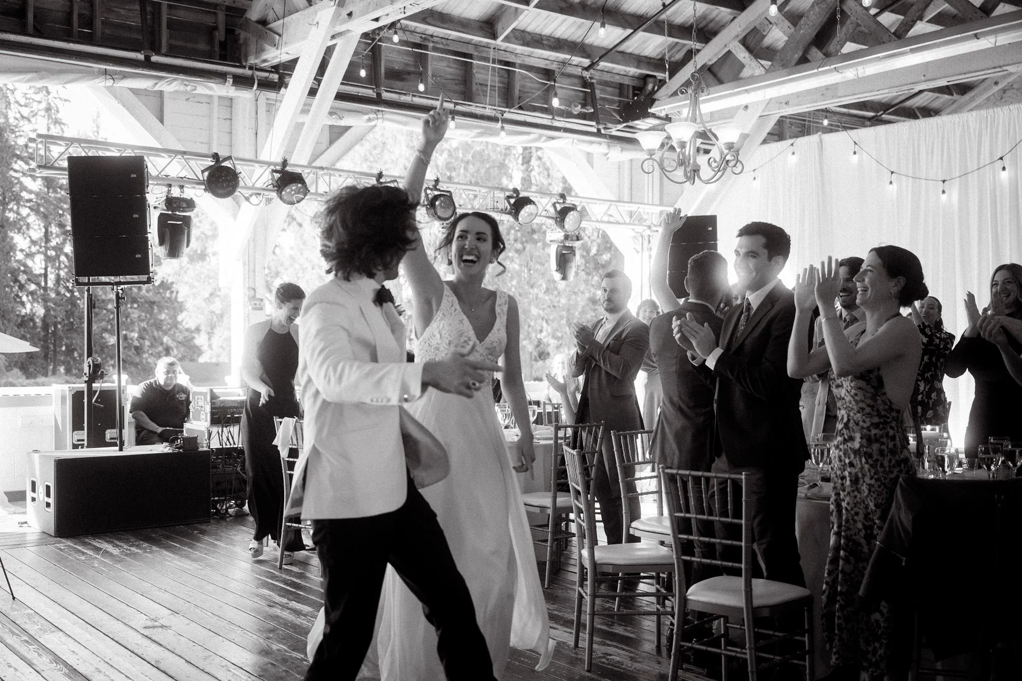 candid wedding reception moments at the rustic pavilion in carnation farms, wa