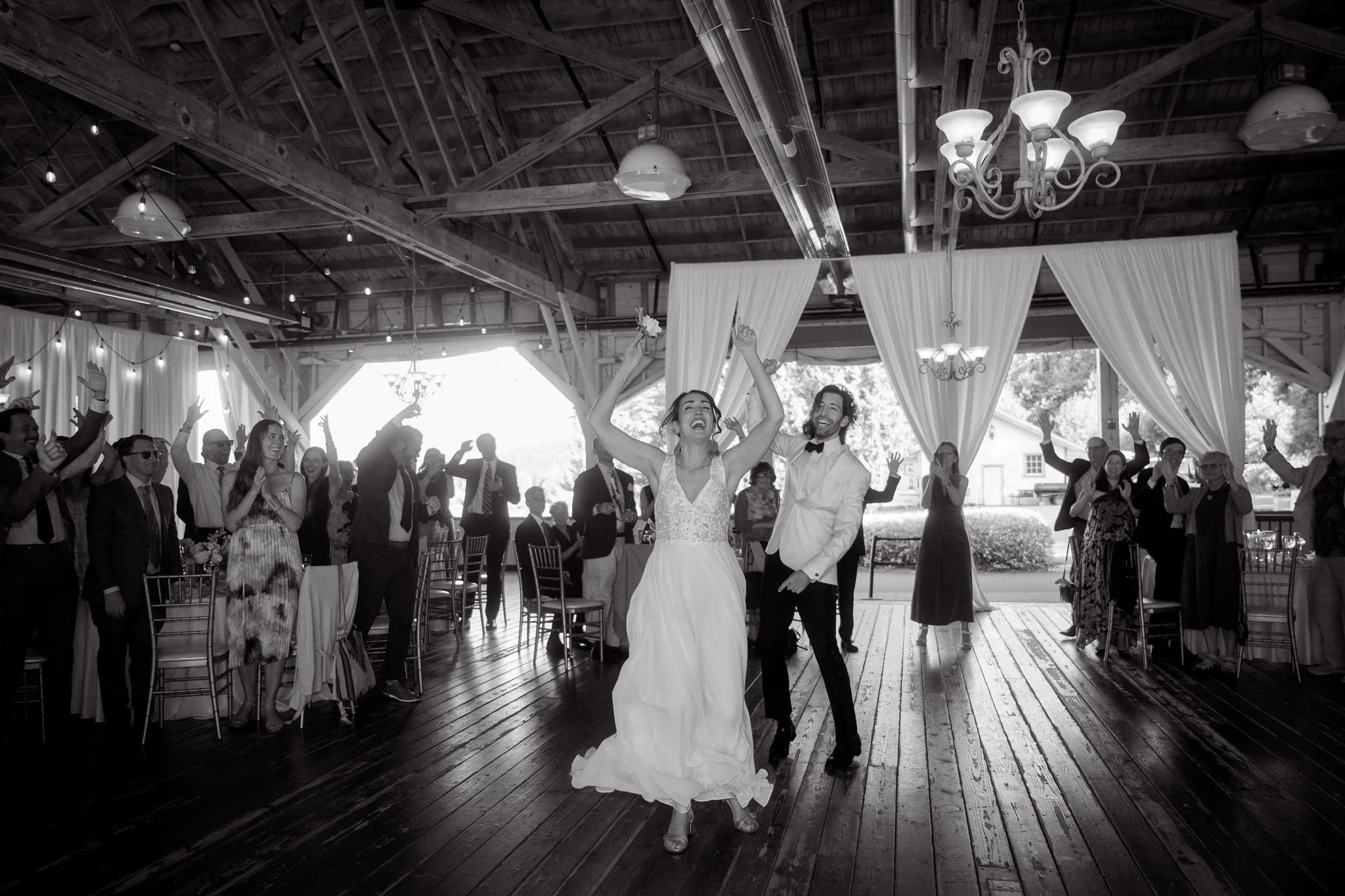 candid wedding reception moments at the rustic pavilion in carnation farms, wa