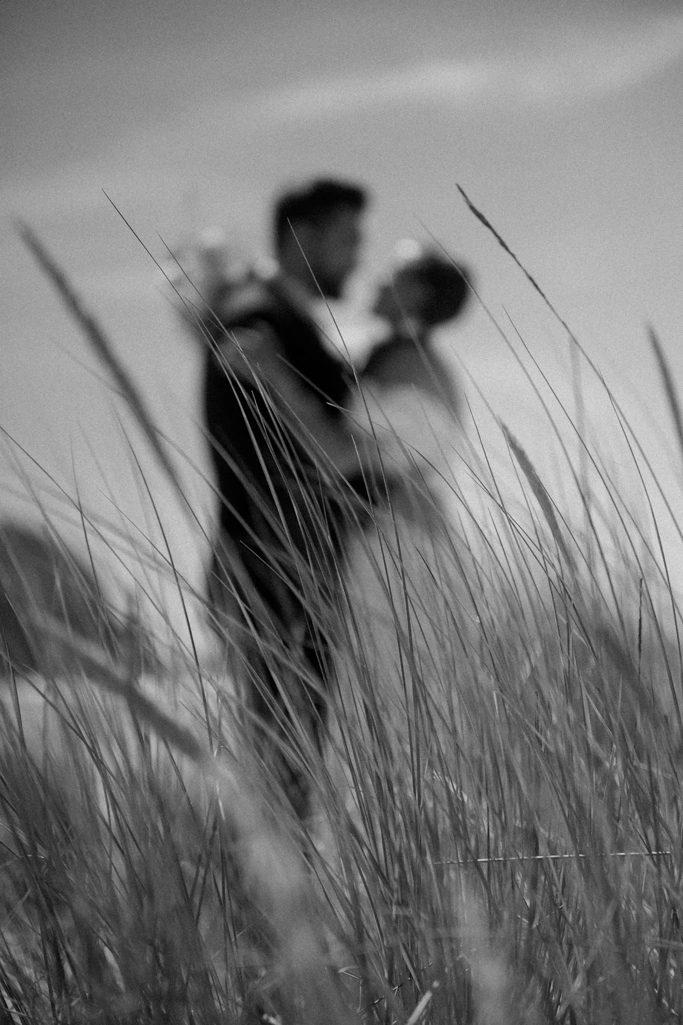 bride and groom at the beach during their cannon beach wedding on the oregon coast 