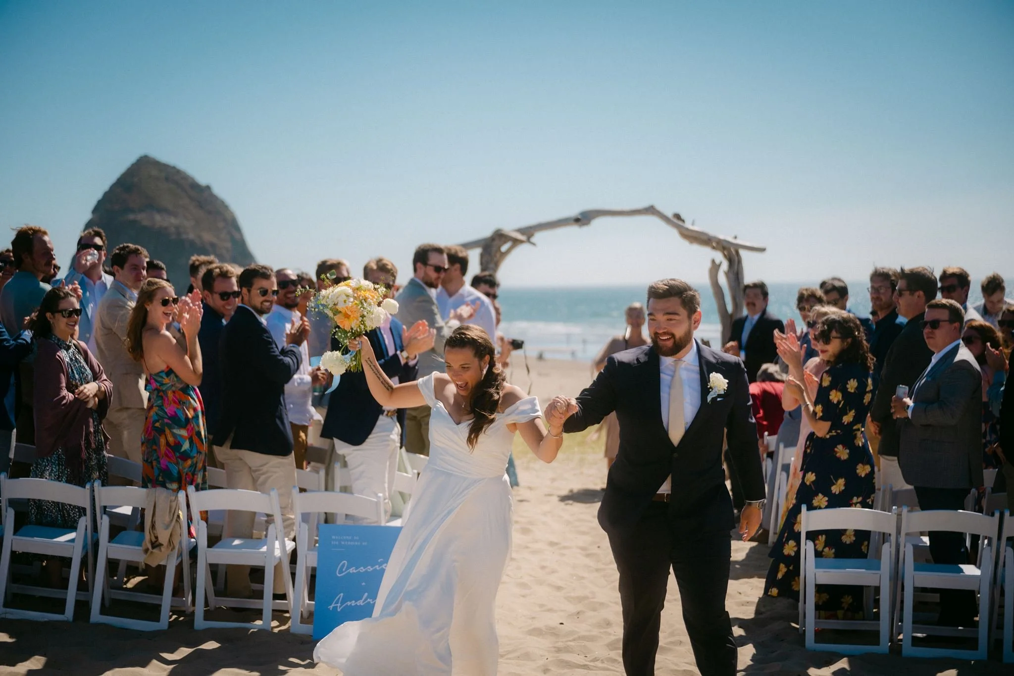 cannon beach wedding ceremony with haystack rock in the background