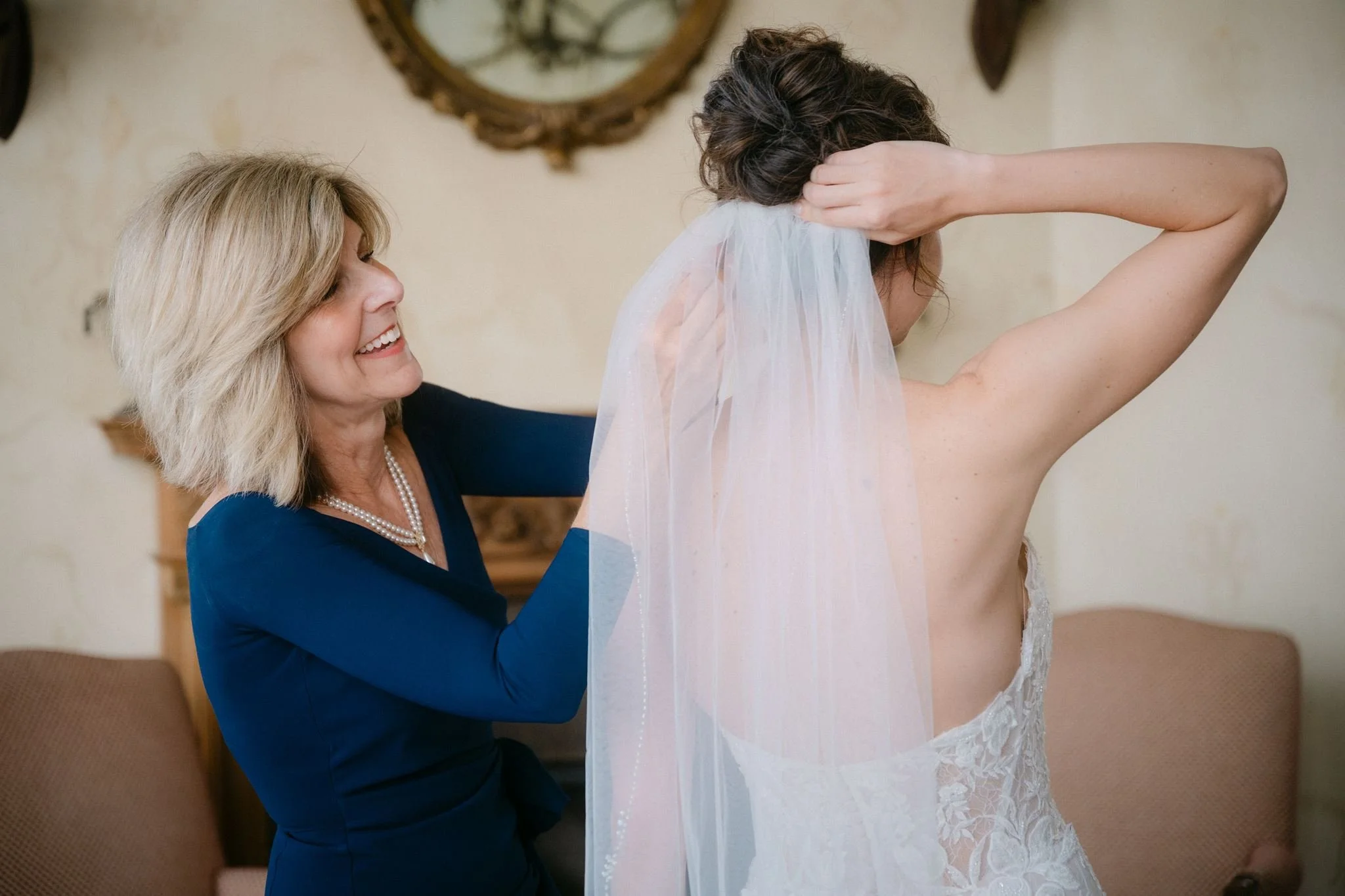 mom helping bride get ready