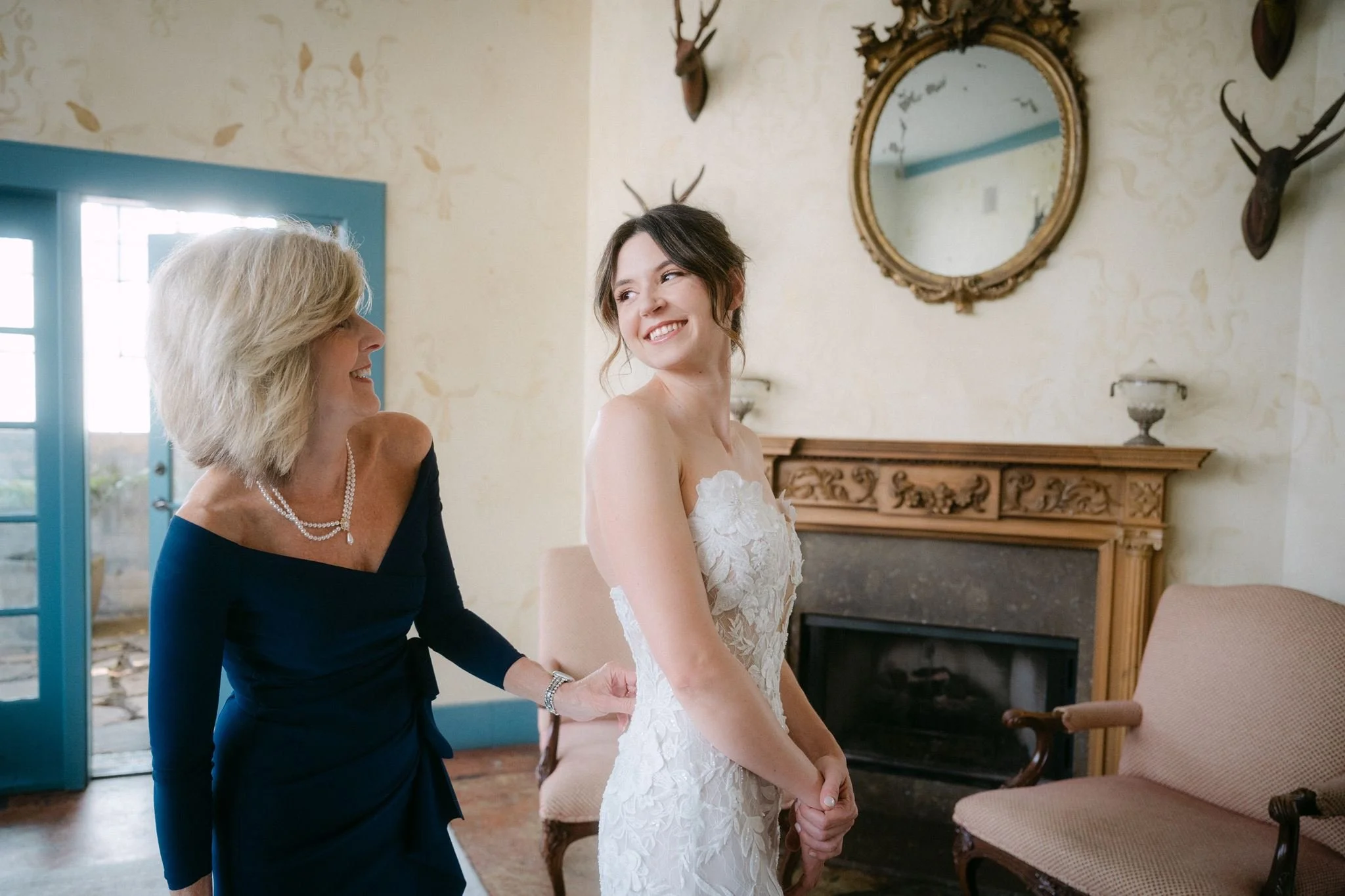 mom helping bride get ready
