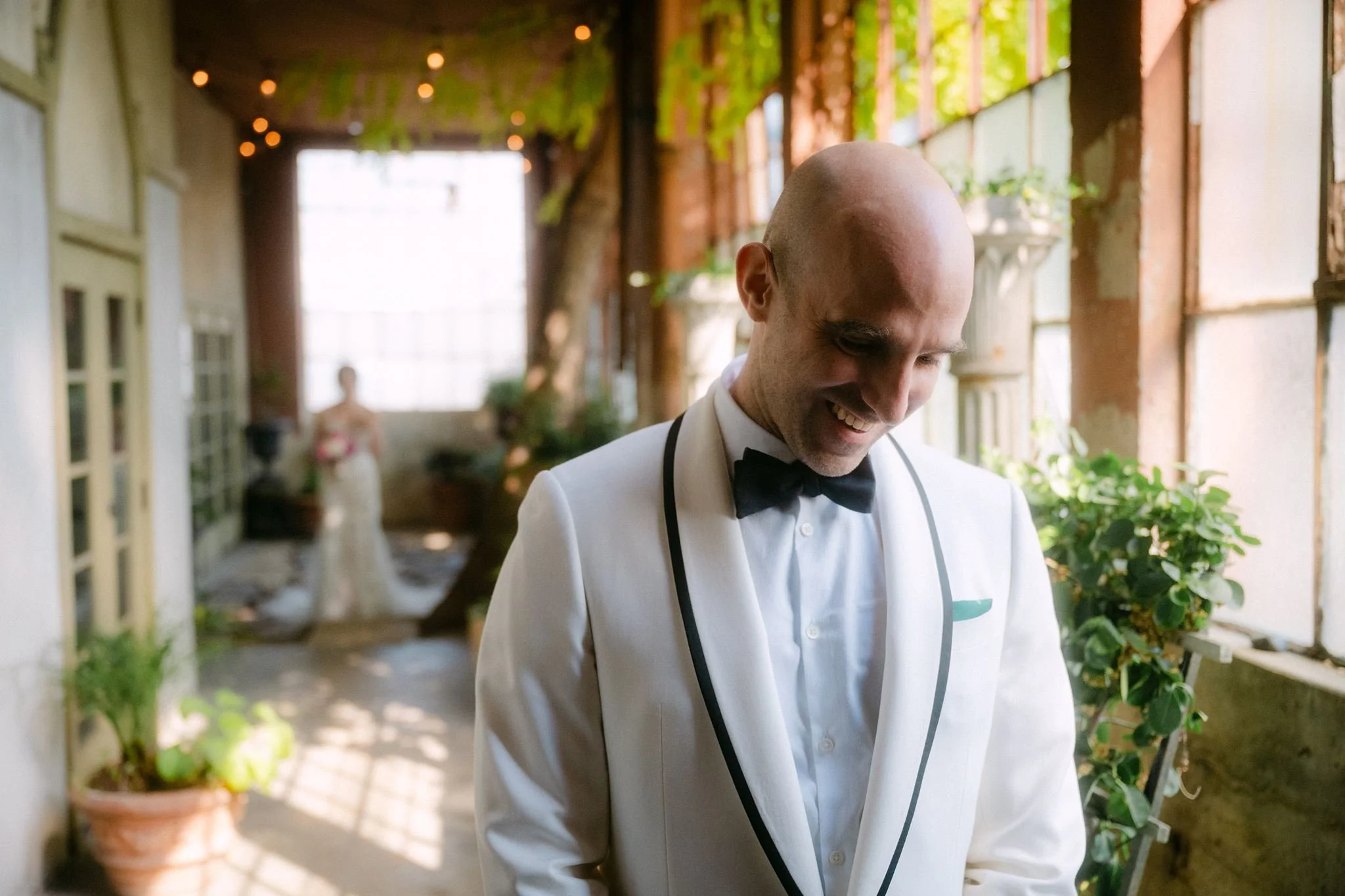 candid bride and groom first look