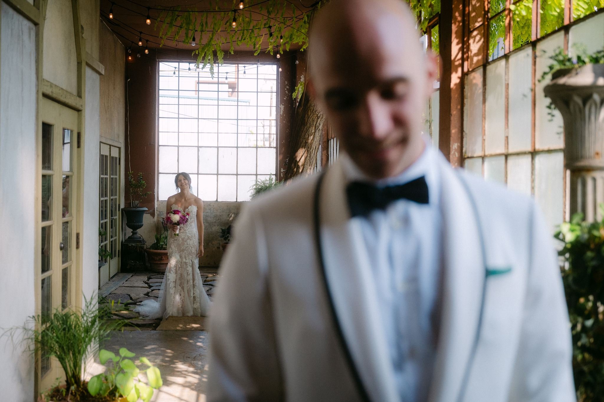 candid bride and groom first look