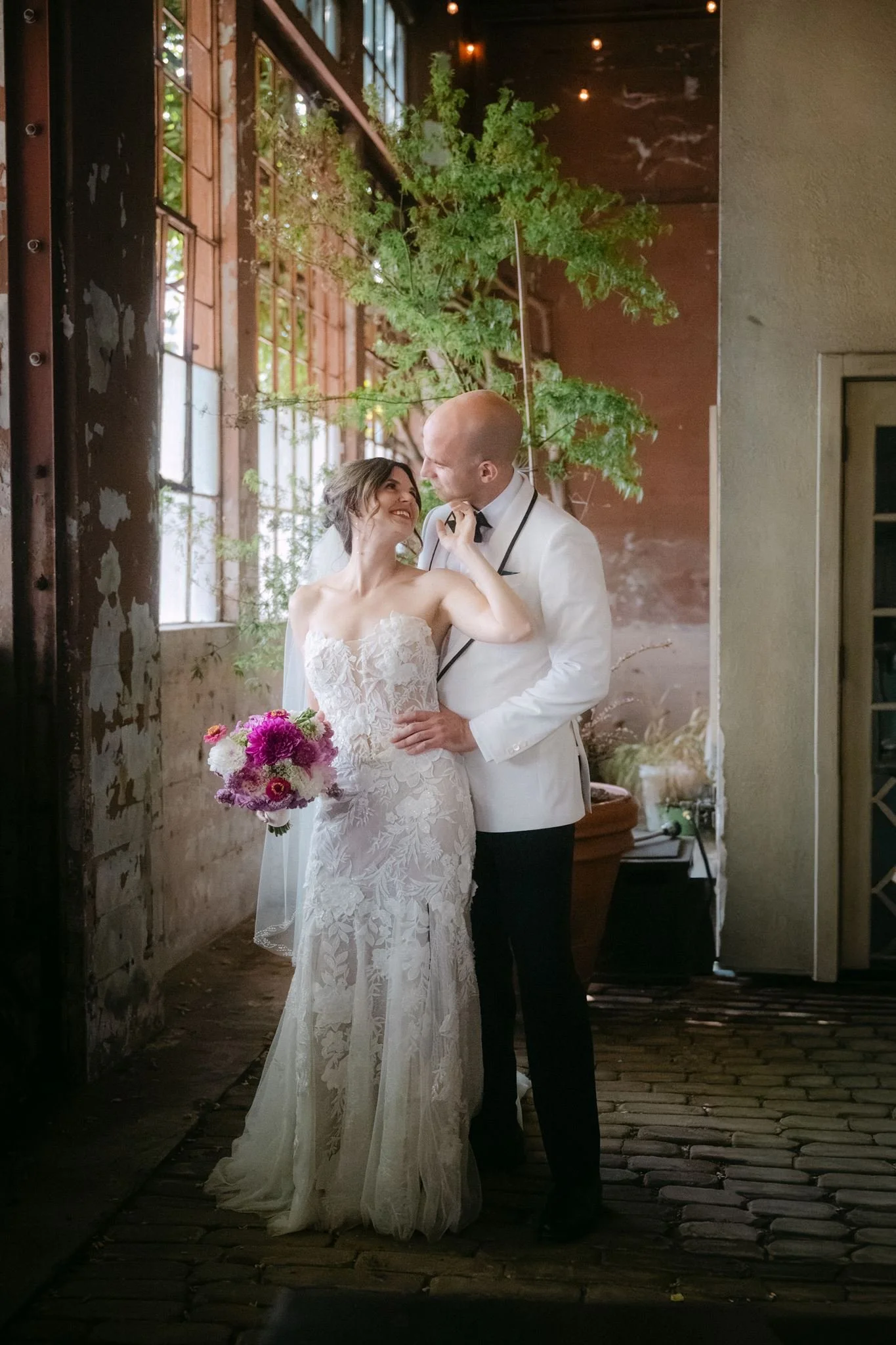 wedding couple hugging during their portraits at the ruins, seattle