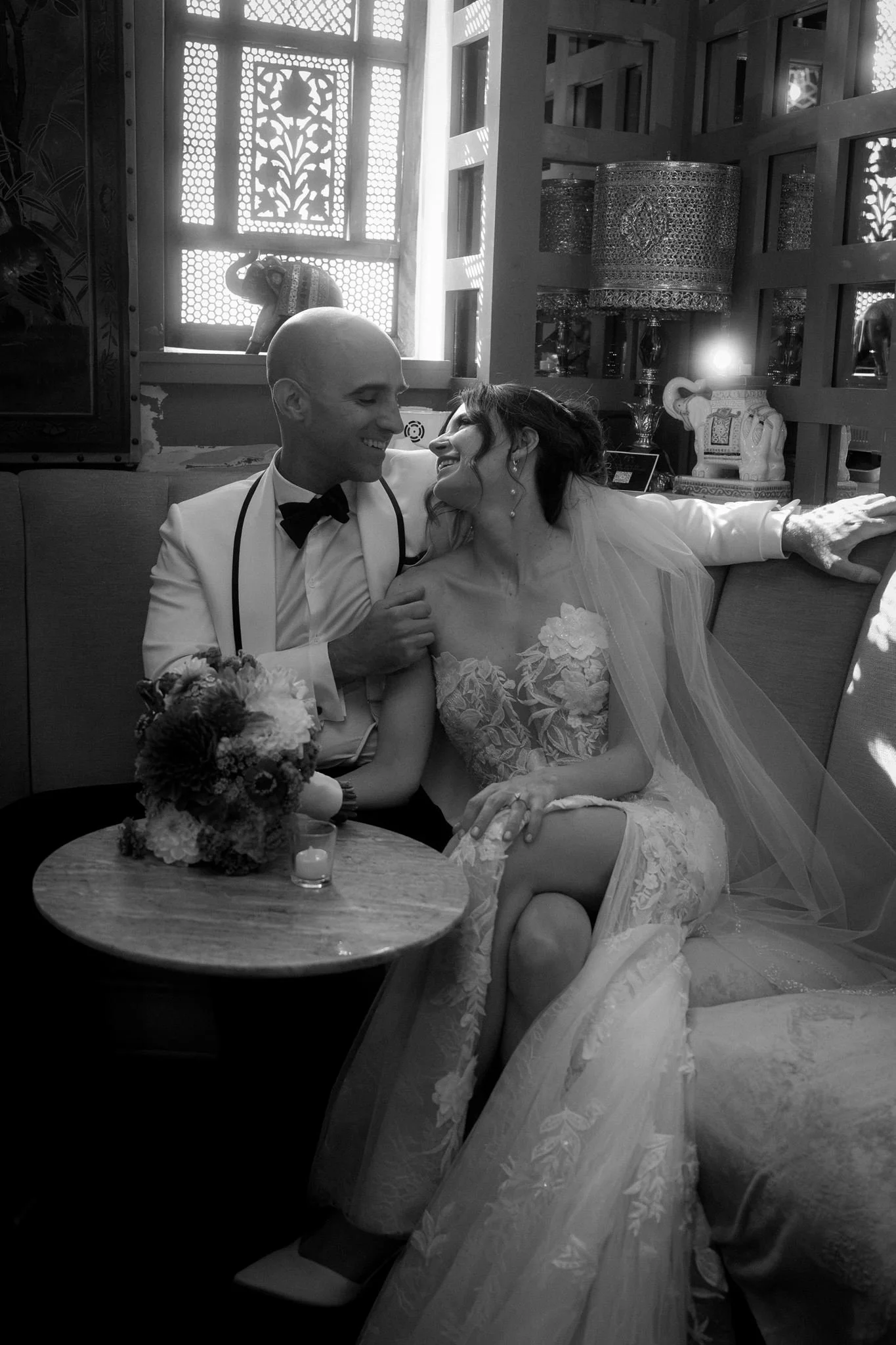 wedding couple kissing on a sofa during their quirky wedding day at the ruins in seattle 