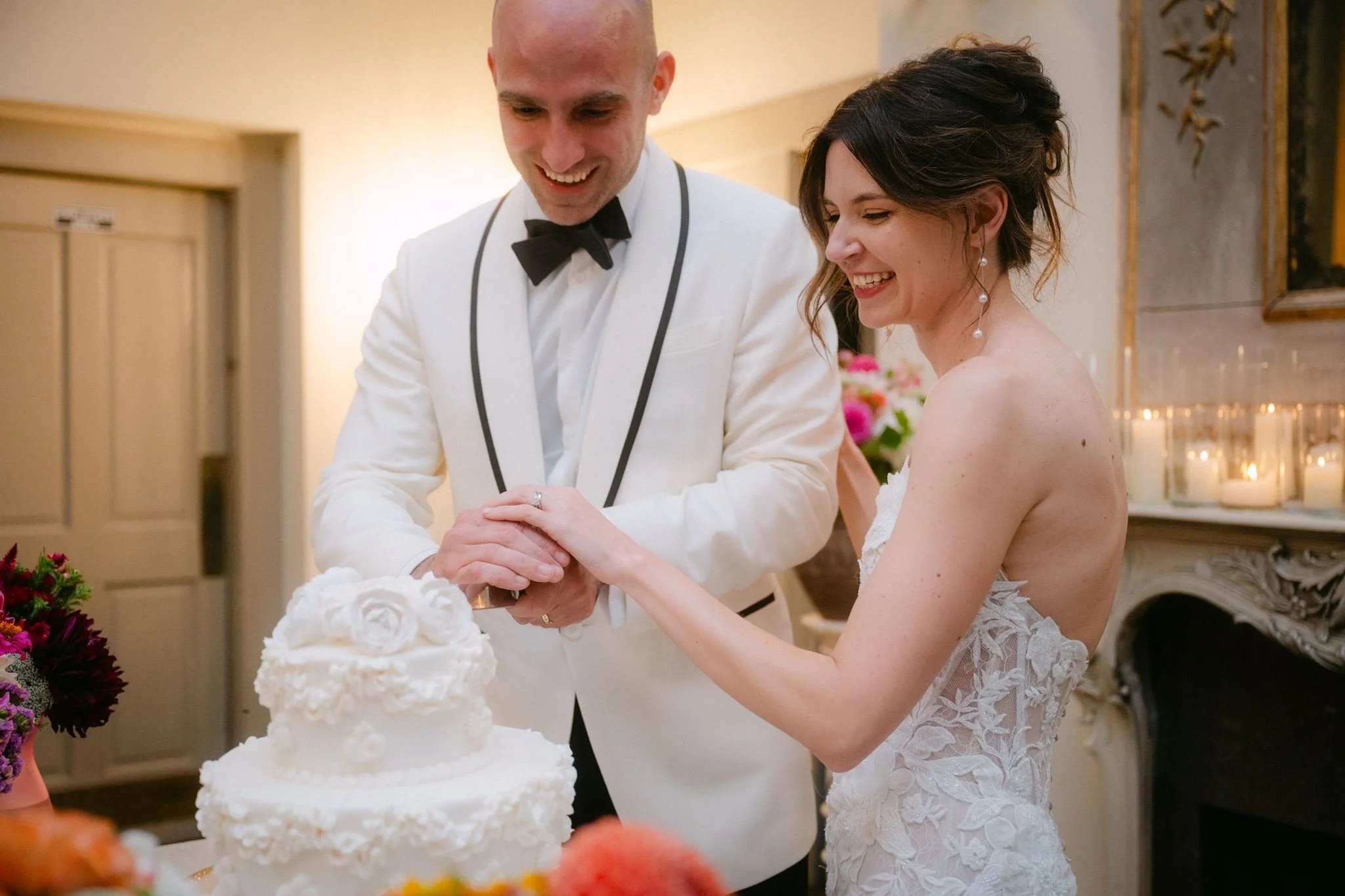 bride and groom cutting cake