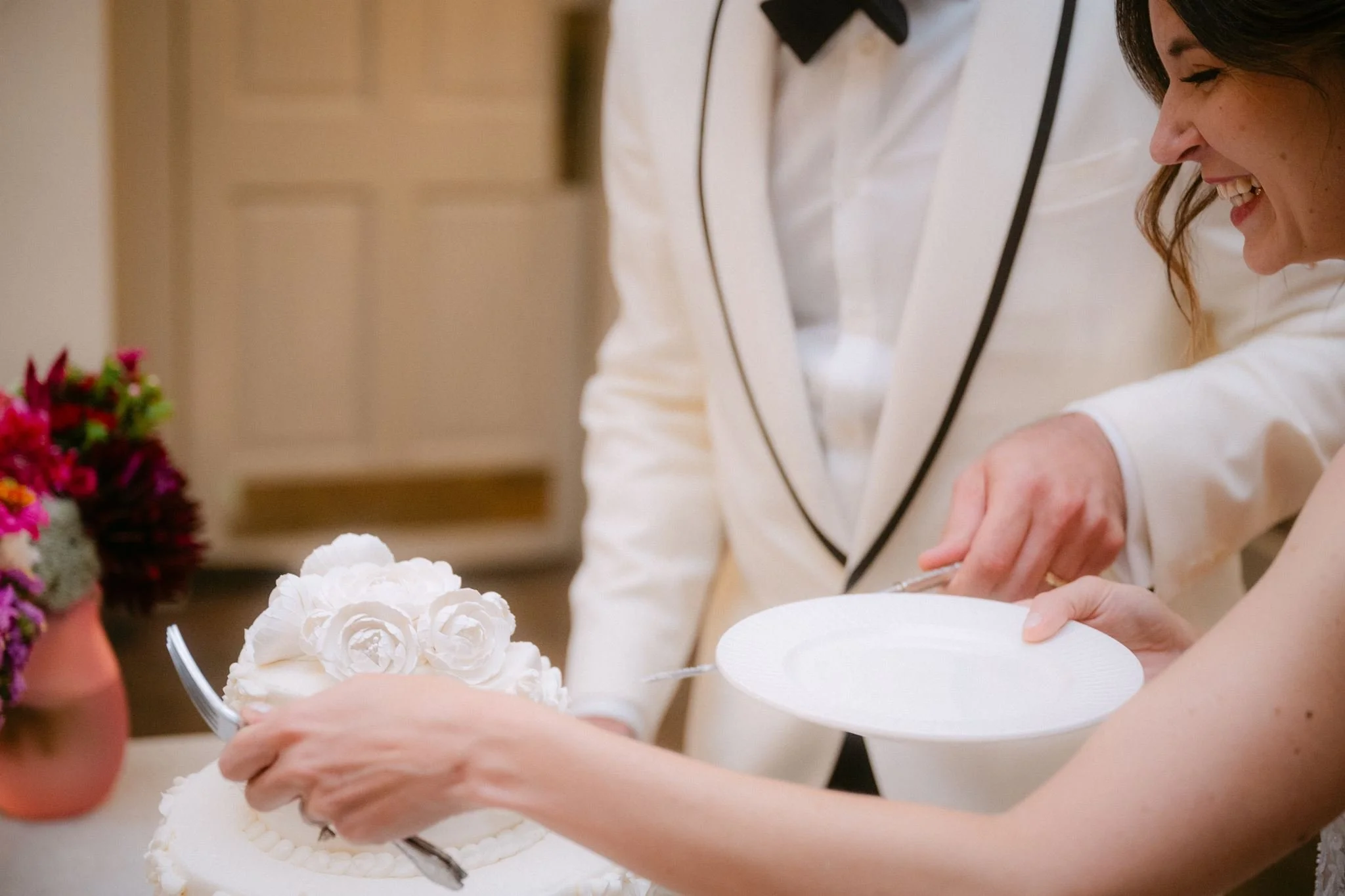 bride and groom cutting cake