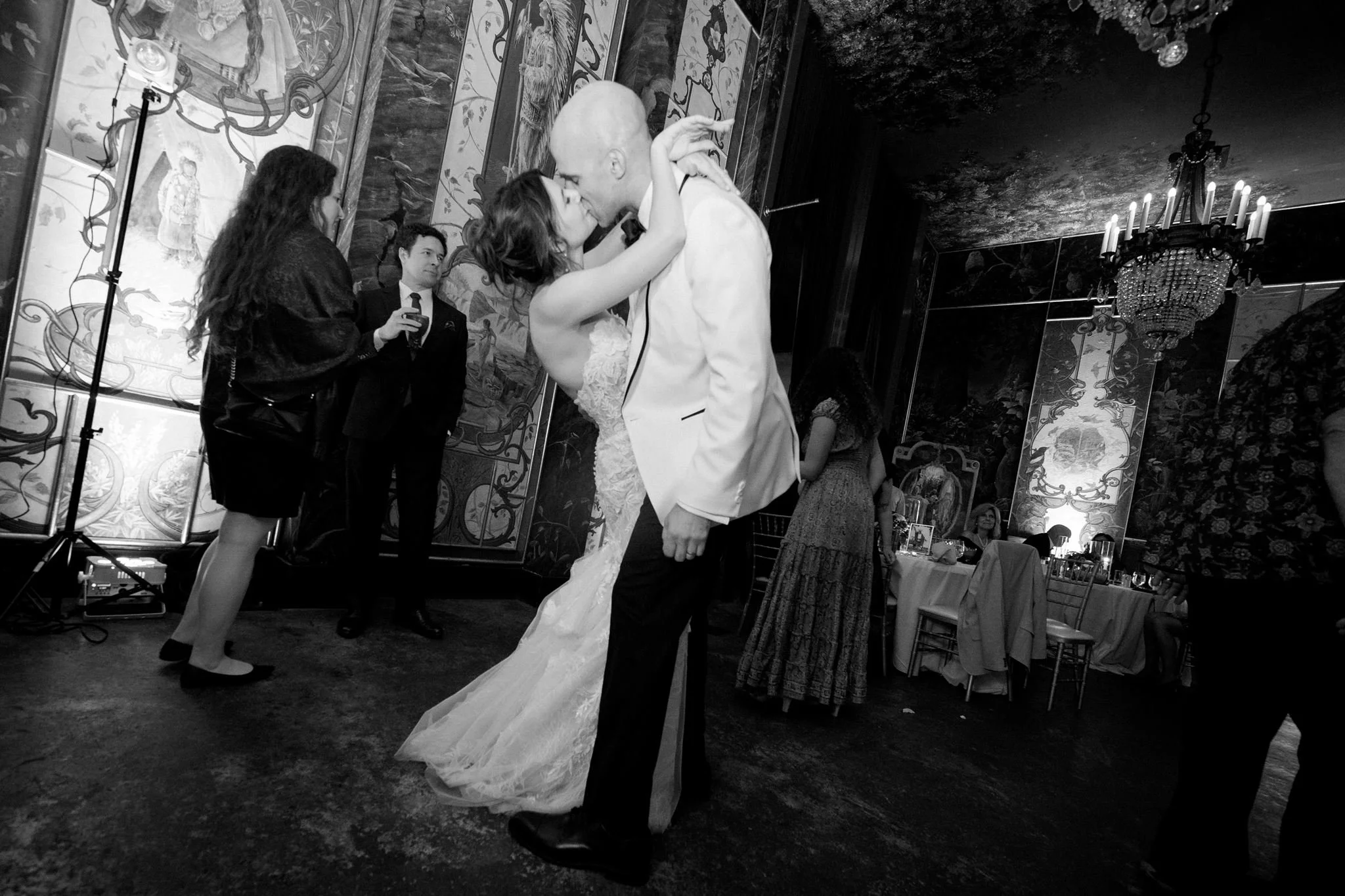 wedding couple kissing during their quirky wedding reception at the ruins, seattle