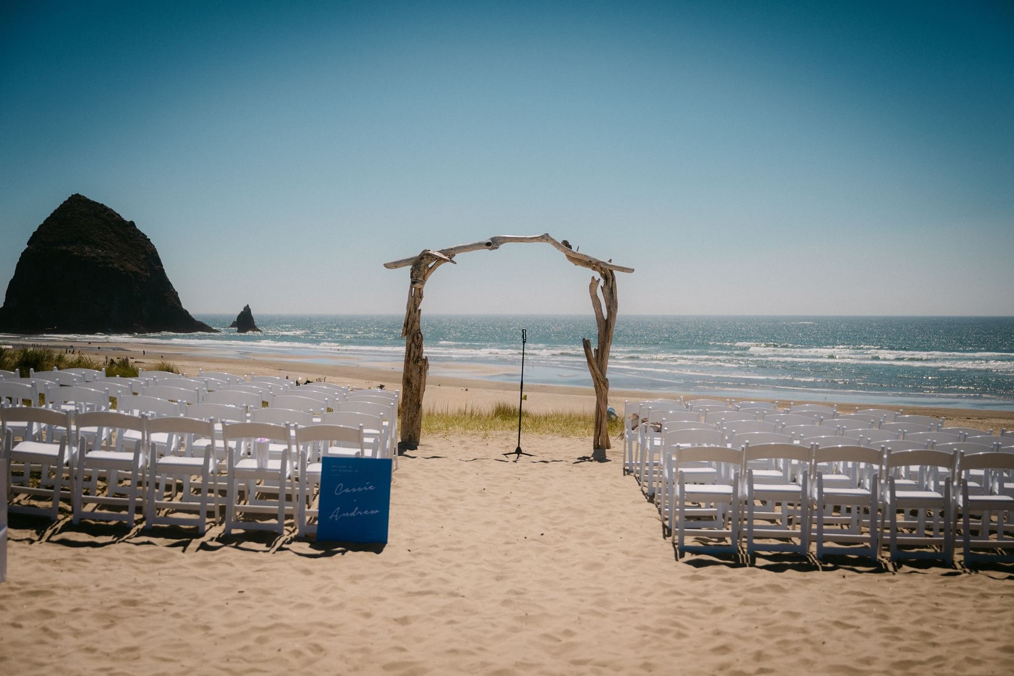 cannon beach wedding ceremony set up with haystack rock in the background