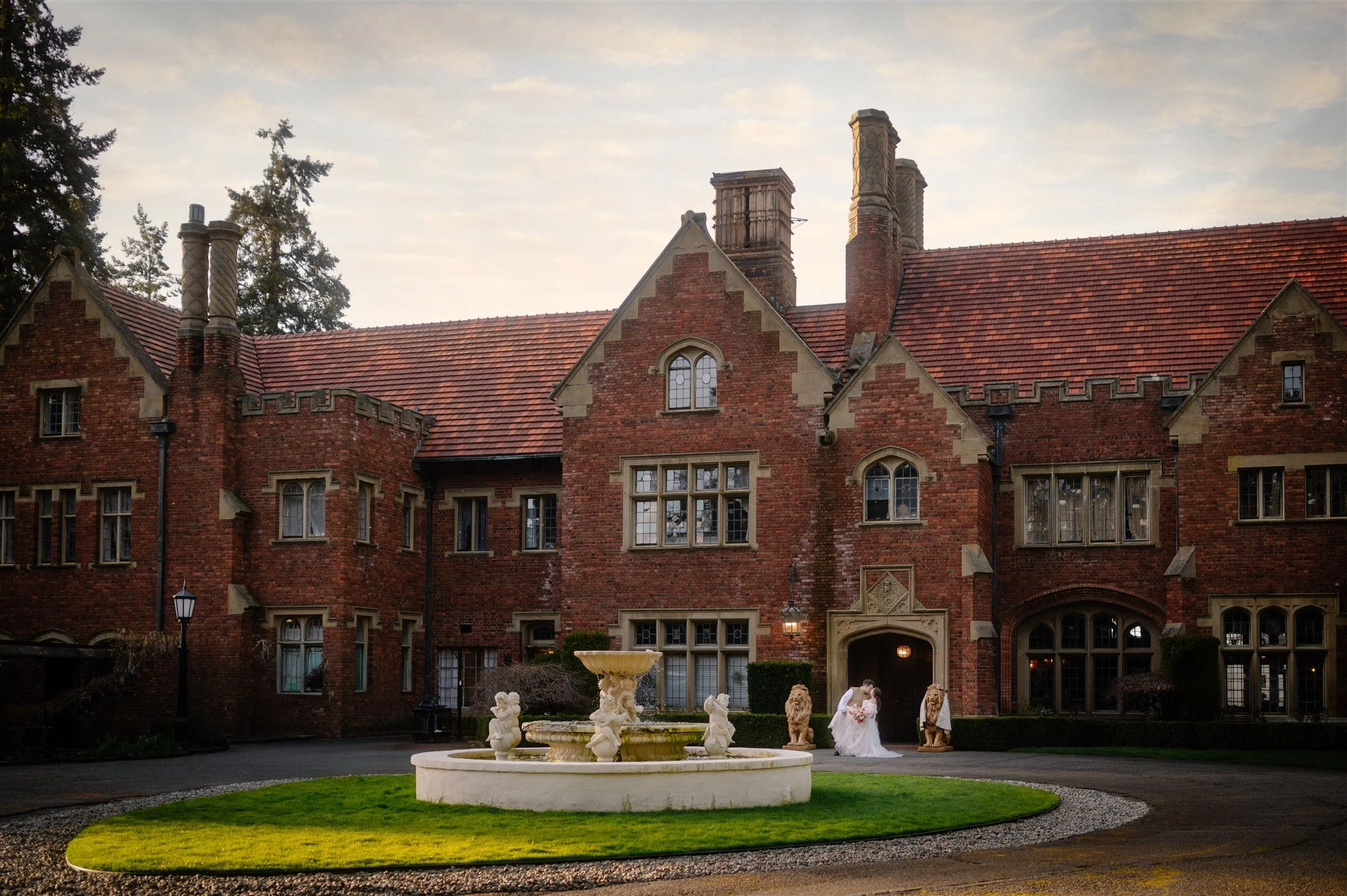 bride and groom holding hands in front of thornewood castle
