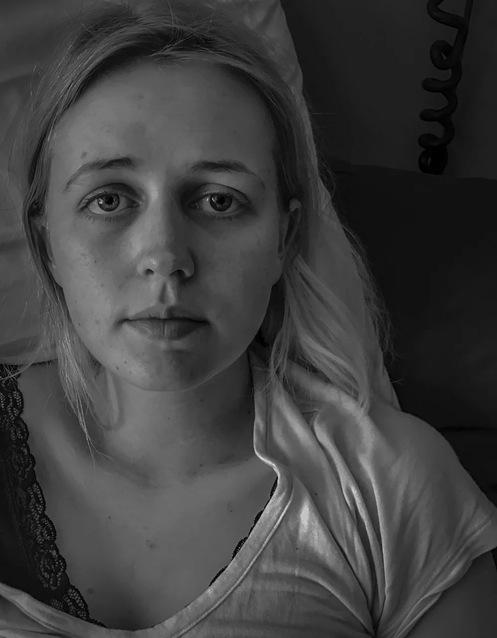 I decided to take a portrait of Faye before she started chemotherapy. Little did I know it would lead to a desire to capture more. It was an exhausting lead up to this day and neither of us knew what we were in for, whether it would be better or worse than we’d imagined. The image for me communicates the apprehension and optimism of Faye at that moment, with the look of fear in her eyes, however her brave, resolute expression holding the optimism. 