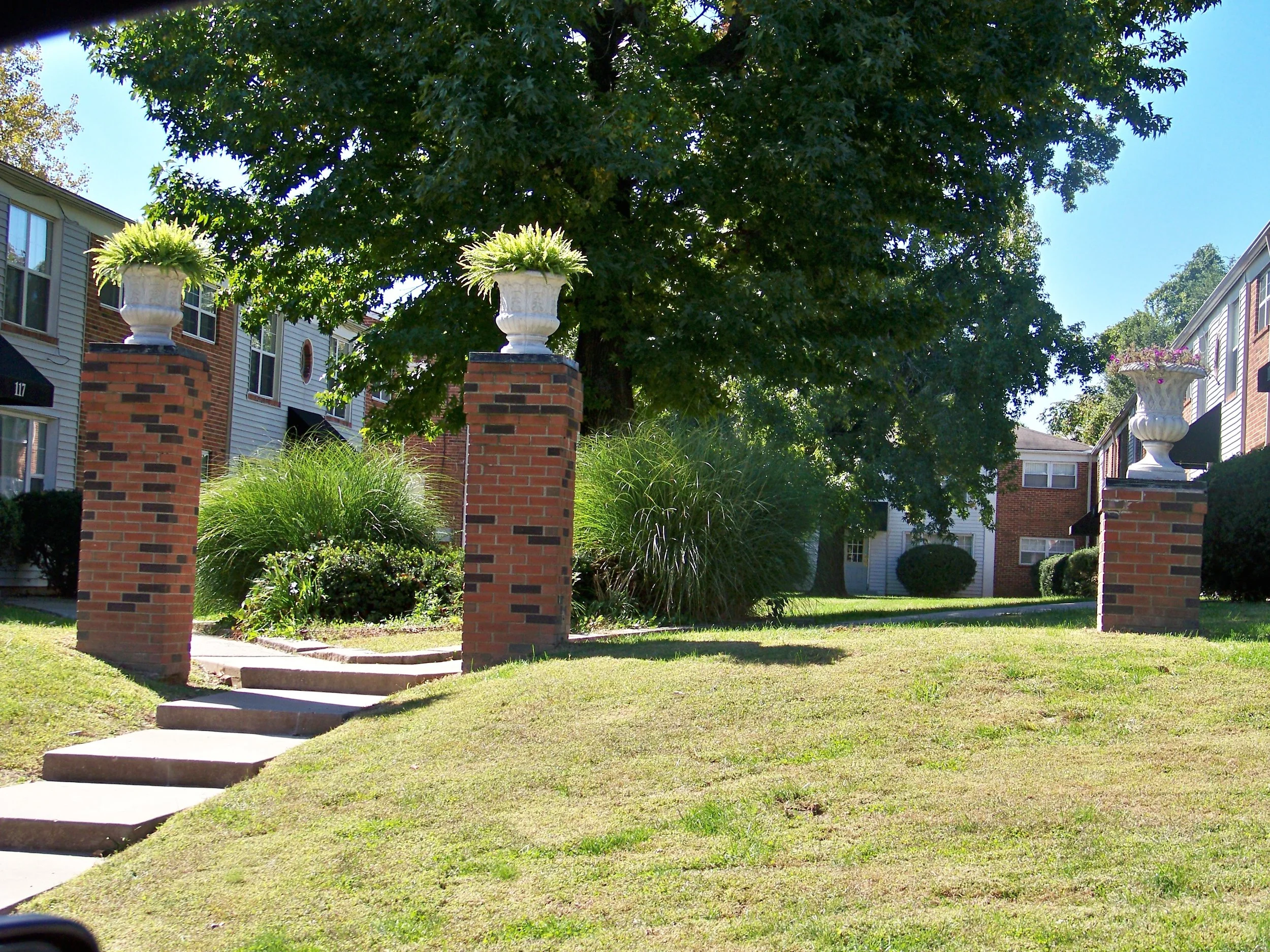 maple manor pillars with plants.JPG