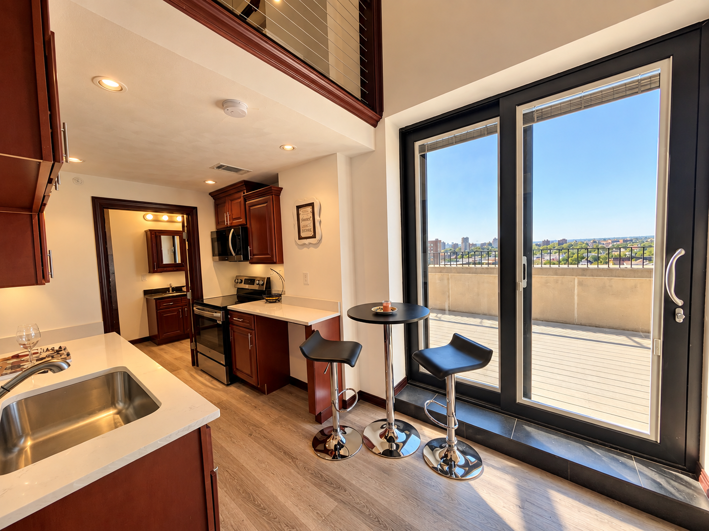 Bright Cherry-Wood Kitchen with Balcony Views.png