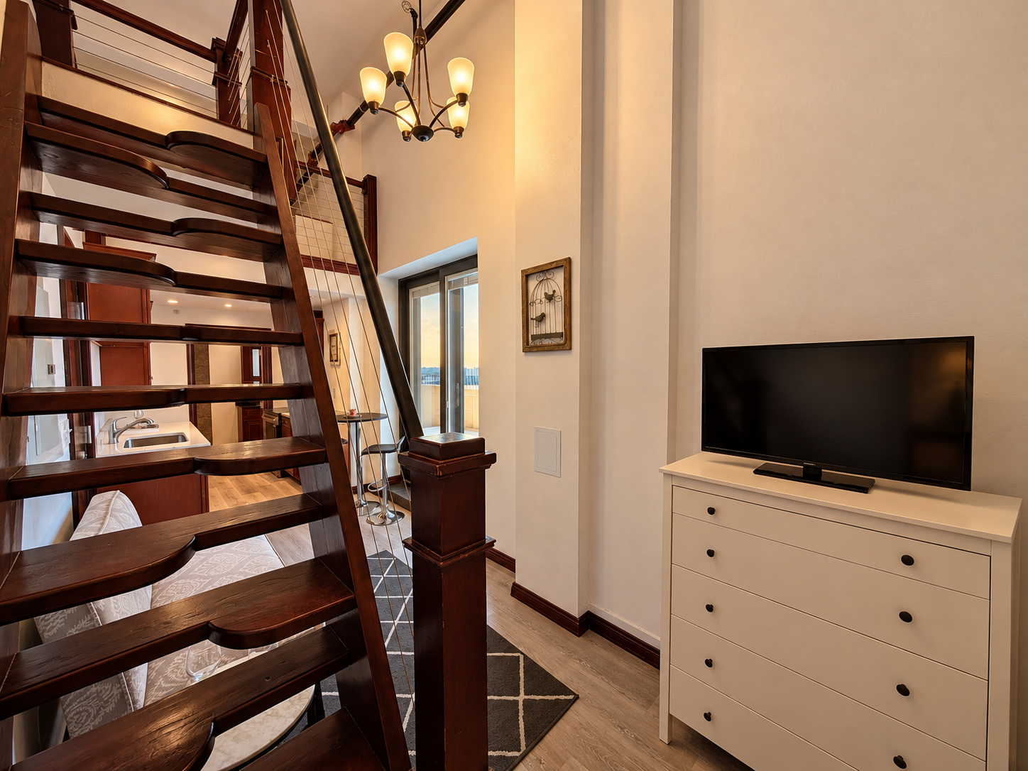 Warm Modern Loft with Mahogany Staircase.png