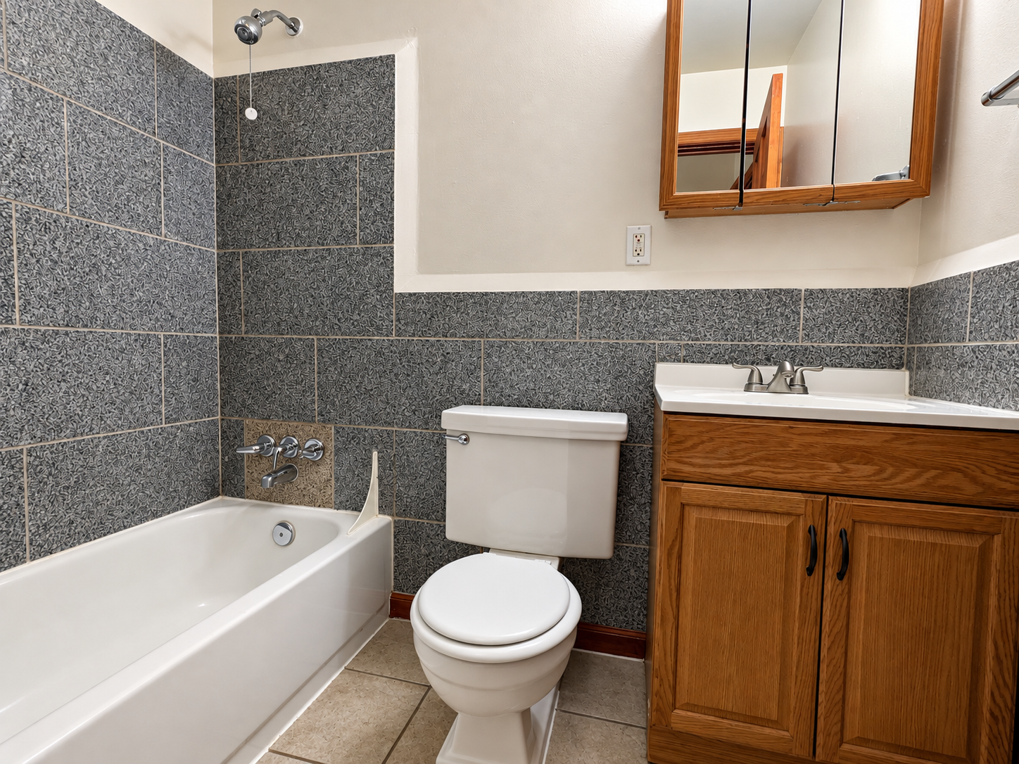 Clean Gray-Tiled Bathroom Interior.png