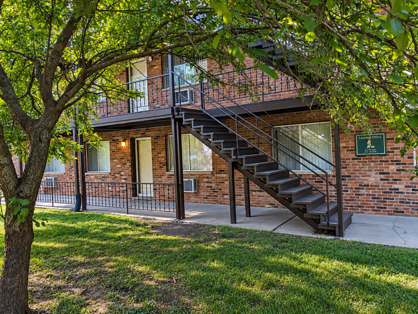Leafy Apartment Courtyard with Staircase.png